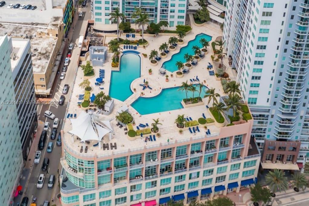 THIS IS THE LARGEST 1 BEDROOM FOR SALE! ALL ASSESSMENTS PAID! MOVE-IN READY.  This large 1006 SF Corner 1 bedroom / 2 bathrooms + home office/den/guest room apartment has a New Kitchen, New Floors, New Washer/Dryer and a Sonos surround sound system. The Primary Bedroom is very big and fits a king-size bed. It’s also a corner with 2 large windows so it is bright and sunny all day long. There is a custom designed walk-in closet and a private bathroom with a window. There’s a separate home office/den/guest room and a 2nd full bathroom. The floors are new with a natural white-wood designed finish.  This unit comes with 1 garage spot and a private storage unit.  Vizcayne South’s lobby welcomes you with 24/7 concierge and security staff. Enjoy many amenities including a 15,000-sq-ft gym & spa complete with massage rooms, sauna, and steam rooms, as well as three stunning lagoon pools with a bar overlooking the bay—and much more. Vizcayne is currently undergoing building updates and all the assessments have been paid by the owner. Easy To Show. Call today!