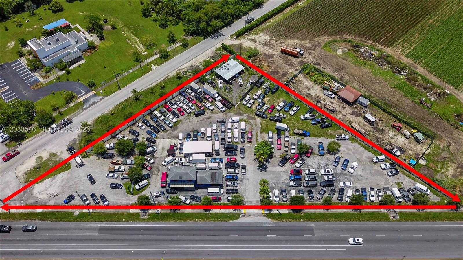 Prime 2.1± Acre Commercial Ground Lease Opportunity located on highly traveled South Dixie Highway (US-1) in Homestead, offering exceptional frontage, visibility, and multiple points of access. The property features a freestanding commercial building with a reception/waiting area, multiple private offices, open workspaces, break room, storage areas, two restrooms, and a fenced, paved yard area. The flexible layout and expansive outdoor space make it ideal for automotive sales, fleet parking, equipment rental, contractor operations, outdoor storage, trucking, landscaping, and a variety of other permitted commercial uses. Strategically positioned near major residential developments with strong daily traffic counts and convenient access throughout South Miami-Dade. Existing business, inventory, vehicles, and equipment are not included and will be removed prior to occupancy. Tenant to verify zoning, permitted use, and all lease requirements. Long-term lease opportunities available. Lease terms subject to owner approval.