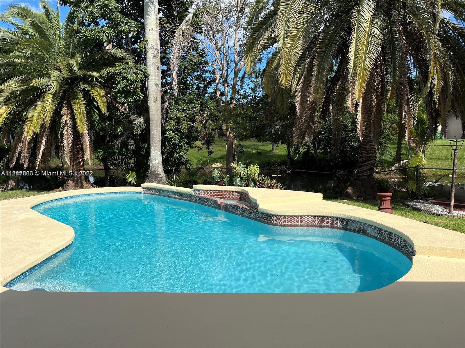 This gorgeous home has 4 bedrooms PLUS DEN 3 bathrooms with a newly redone pool on the water. Granite countertops, stainless steel appliances, huge island, the perfect entertainer’s kitchen. This home is zoned for the highly desired Cooper City schools and located directly across the street from the JCC, minutes from shops and restaurants. The primary suite plus an additional bedroom and bathroom are located on the first floor and 2 bedrooms plus a full bathroom are on the second floor. Garage is converted to a bonus room that can be an office/den/ or 5th bedroom with AC. The Driveway can park 6 cars. No HOA approval required to move in. Available NOW