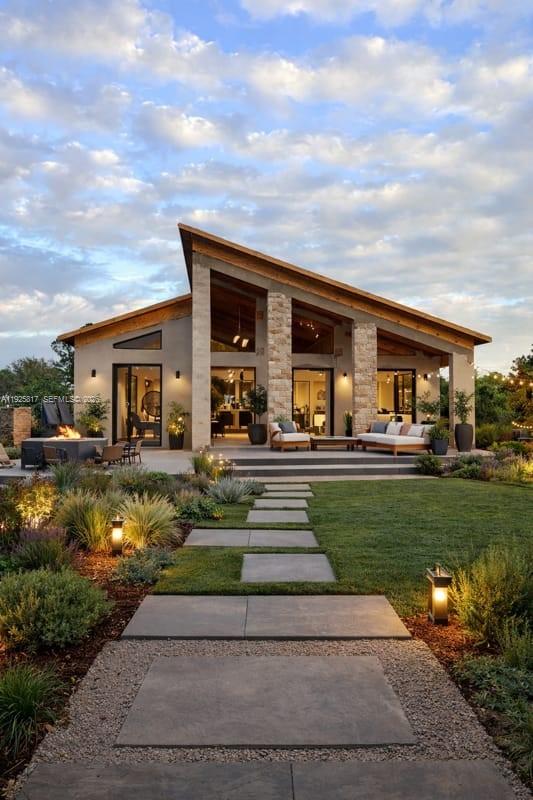 From the moment you arrive, the home impresses with its bold architectural lines, symmetrical façade, and dramatic glass elements that invite abundant natural light throughout the interior. Set on an expansive 2.5-acre lot in Montura Ranch, and 3521 sqft living area, this striking contemporary residence offers a refined blend of modern design, space, and lifestyle. 
The design emphasizes openness and connection with the outdoors. Floor-to-ceiling glass and expansive sliding doors create a seamless transition between interior living spaces and the beautifully landscaped exterior, ideal for entertaining or enjoying quiet moments surrounded by nature. The covered outdoor living areas provide an inviting setting for gatherings, relaxation, and evening ambiance under the Florida sky.

Clean lines, neutral tones, and thoughtfully designed proportions define the home’s aesthetic, creating a sense of calm sophistication. The open layout allows for flexible living and dining arrangements, while the visual connection to the outdoors enhances both comfort and elegance.
With ample land offering privacy, serenity, and endless possibilities, this property is a rare opportunity for buyers seeking modern luxury without compromise. Designed to embrace light, space, and the surrounding landscape, this residence delivers a distinctive lifestyle where architecture and nature coexist effortlessly.