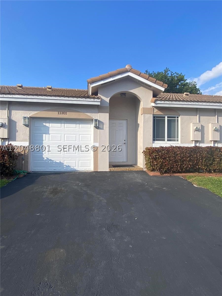 Welcome to this beautifully renovated and meticulously cared-for villa in the desirable gated community of Villages of Renaissance.  Enjoy a prime private location with no neighbors behind, offering peace, privacy, and beautiful green surroundings.  This spacious 2-bedroom, 2-full-bath home features a desirable split floor plan, a one-car garage, additional driveway parking, and plenty of guest parking throughout the community.  The bright and open layout is designed for comfortable living and entertaining.  The updated kitchen boasts white cabinetry, granite countertops, stainless steel appliances, and a convenient breakfast bar overlooking the spacious dining and living areas.  Both bathrooms have been tastefully renovated, and the entire home has been freshly painted and is truly move-in ready.  French doors open to a private patio, providing the perfect spot to relax and enjoy the tranquil setting.  The primary suite features a walk-in closet, and the home also includes a washer and dryer for added convenience.  Residents of Villages of Renaissance enjoy an exceptional lifestyle with a clubhouse, sparkling pool, cabana, tennis courts, and beautifully maintained green spaces perfect for walking, relaxing, and enjoying the outdoors. Ideally located close to shopping, dining, major expressways, places of worship, and everyday conveniences, this villa offers the perfect combination of comfort, privacy, and resort-style living.