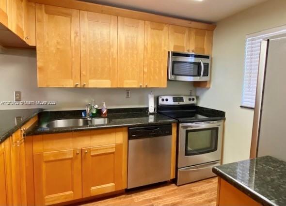 Remodeled 2/2 on 1st floor. Larger unit than most with extra windows, too. Split floor plan. Open kitchen. Peaceful garden views. Accordion shutters throughout. AC 2016. Great location. Close to shops, restaurants, Publix, Hard Rock, Airport, Beaches and so much more. No leasing for 2 years.