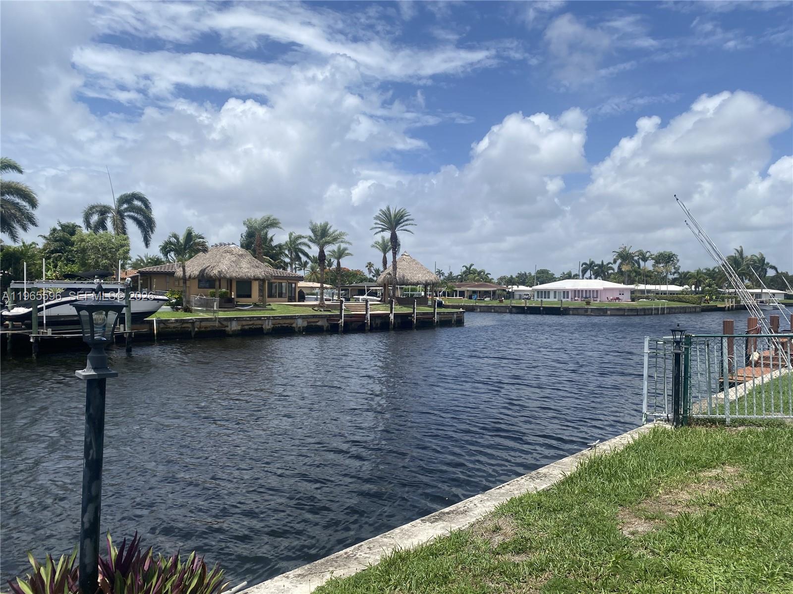 Prime waterfront location with sweeping canal views in one of South Florida’s most exciting redevelopment zones. Enjoy sunny poolside days along the water while the Atlantic Blvd corridor evolves into a luxury urban destination—an area where values continue to rise.

This beautifully renovated 2-bed, 2-bath residence offers a modern, move-in-ready interior featuring granite countertops, stainless steel appliances, marble bathrooms, and wood-laminate flooring throughout. Hurricane-impact windows, generous walk-in closets, and a rear bay window enhance natural light and capture the tranquil water views.The boutique 12-unit building has been freshly painted and recently upgraded with new asphalt and parking lot striping. A front-loading washer and dryer are conveniently located inside the unit. 40- and 50-year building certifications are complete, offering added peace of mind.