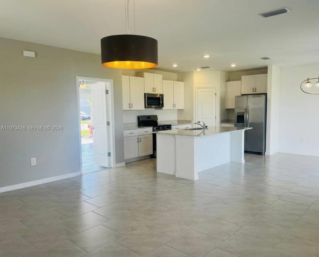 Welcome to this brand-new two-story home located in the growing community of North Fort Myers. This modern residence features 4 spacious bedrooms, 2.5 bathrooms, a 2-car garage, and a private backyard overlooking a beautiful lake. The interior offers a bright and functional layout with quartz countertops, stainless steel appliances, and luxury finishes throughout. Conveniently located just 10 minutes from I-75 and 5 minutes from US-41, with quick access to shopping centers, restaurants, and essential services. Enjoy the comfort and peace of mind of living in a completely new home designed for modern living. Schedule your private tour today.