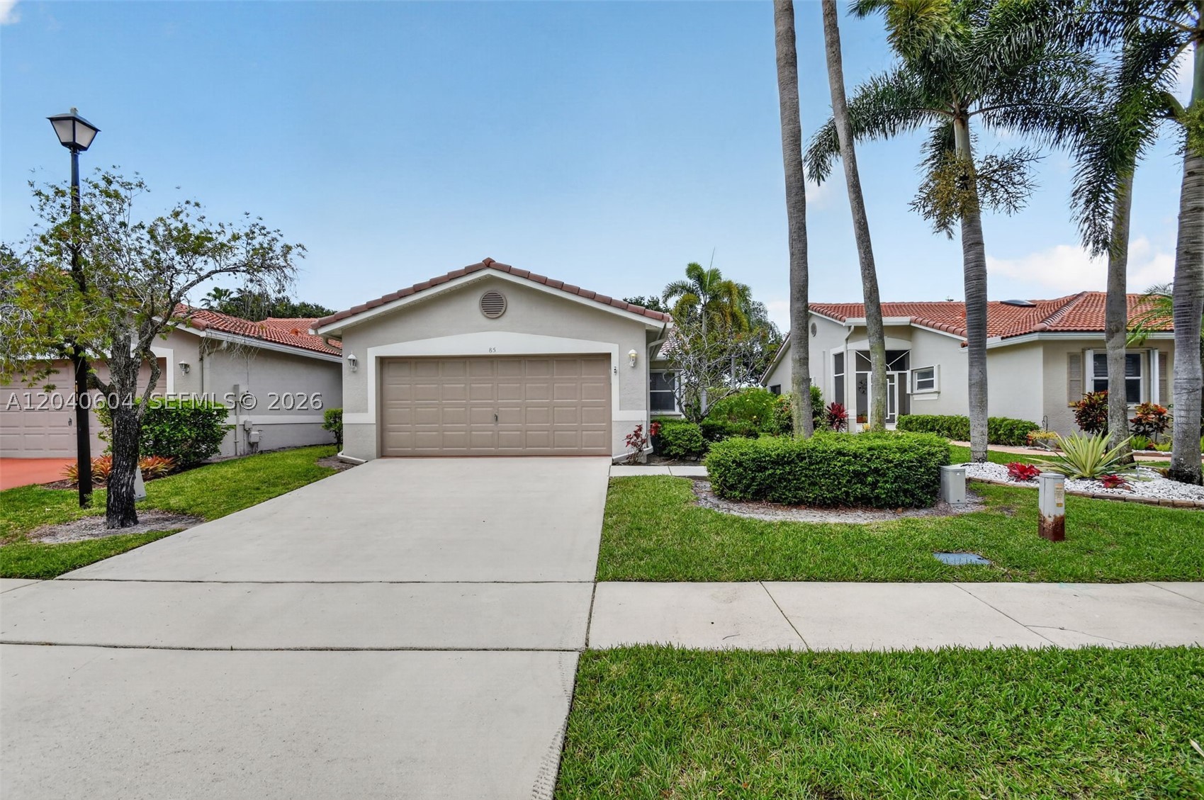 Beautifully updated 2 bed, 2 bath villa style townhome with a den and double car garage. Welcome to 85 Sausalito Drive located in the upscale 55+ community of Sausalito Place in Boynton Beach Florida. This home features covered and enclosed entry-lanai, double door entry into den which could be a 3rd bedroom, covered screened patio, vaulted ceilings, updated eat in kitchen area, pantry, and updated bathrooms. The community amenities include a clubhouse with a state of the art fitness center, swimming pool, sundeck and tennis courts. Sausalito Place is located within a mile radius of shopping, grocery and dining and a just few minutes from the Boynton Beach marina and intercostal.