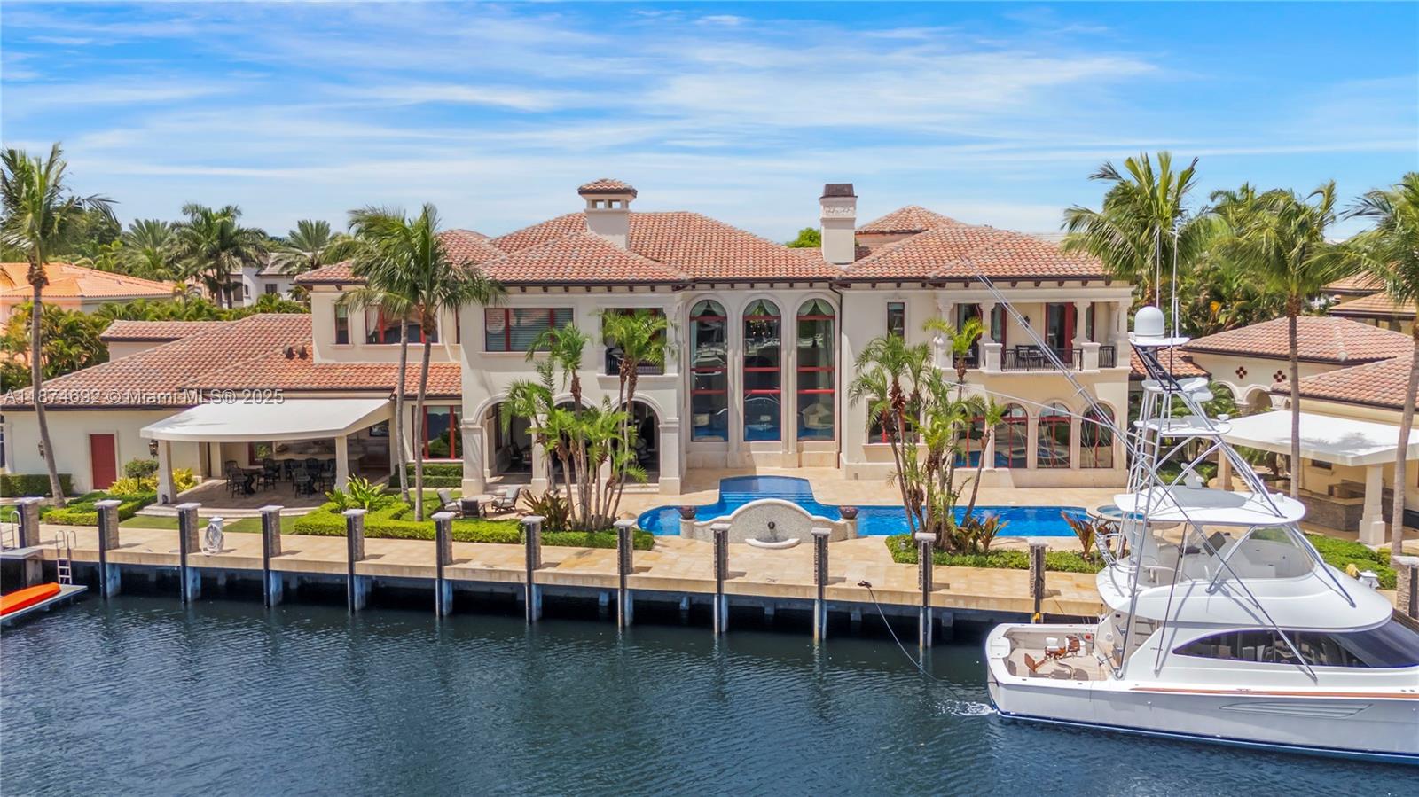Offering nearly 16,000 sq ft of elevated indoor/outdoor living space, this masterpiece spans approx 12,000 sq ft in the main house with 7 bedrooms and 11 bathrooms, 240 ft of Intracoastal frontage with a private dock, 33,000-lb boat lift, dual jet ski floats, built-in pressure wash system plus a resort-style pool resurfaced in 2024. Features include a newly upgraded smart home system, elevator, sauna, central vacuum system, tankless gas water heater, newly improved water filtration system, executive office, panic room, hurricane-rated doors, windows, and patio screens, plus a fishing room with commercial freezer, 2 laundry rooms, and a 7-car garage. Located just minutes from premier schools, dining, and recreation, this estate embodies the pinnacle of South Florida’s Riviera lifestyle.