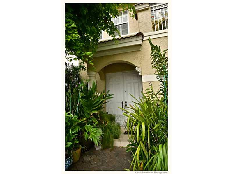 SPECTACULAR TOWNHOUSE IN DESIRABLE DORAL AREA, COSTA D'ORO. COMPLETELY UPDATED WITH EXCLUSIVE HIGH END DESIGNER UPGRADES.  2 BEDROOMS 2.5 BATHS.  PORCELANOSA THROUGHOUT THE 1ST FLOOR.  CARPET ON SECOND FLOOR.  GE-PROFILE STAINLESS STEEL APPLIANCES, GRANIT E COUNTER TOPS.  ANTIQUE PATIO PAVERS**ORIGINAL OWNER**FURNITURE IS ALSO FOR SALE**