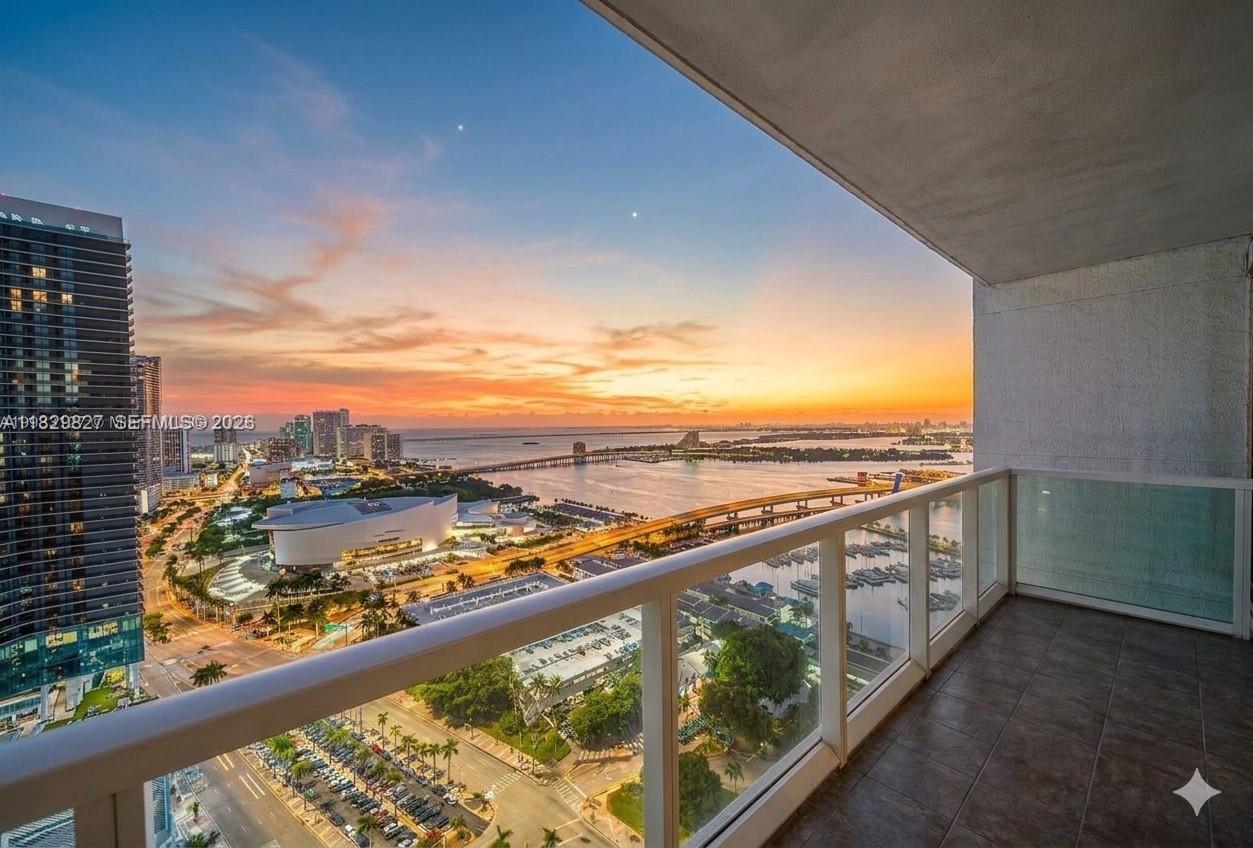VIZCAYNE | 37TH FLOOR — PANORAMIC VIEWS OF BISCAYNE BAY, CRUISE PORT, KASEYA CENTER & BAYSIDE MARINA. 806 SF 1BD/1BA high above Downtown Miami with floor-to-ceiling glass, oversized balcony, marble bath with separate tub & shower, granite kitchen, SS appliances & enclosed in-unit laundry. Low-density building — only 8 residences per floor. Resort amenities: 3 pools, fitness center, spinning room, spa with jacuzzi, sauna, steam room, massage rooms & private theater. Storage & assigned parking included on the 3rd floor. Steps from Bayfront Park, Bayside Marina, Worldcenter, Brightline & Kaseya Center. Minutes to Brickell, Wynwood & Design District. Adjacent to the future Waldorf Astoria Miami — the city's tallest ultra-luxury tower — driving long-term appreciation. STR-permitted (30-day min, 12x/yr). Tenanted at $2,850/mo through Jan 2027 — immediate cash flow from day one.