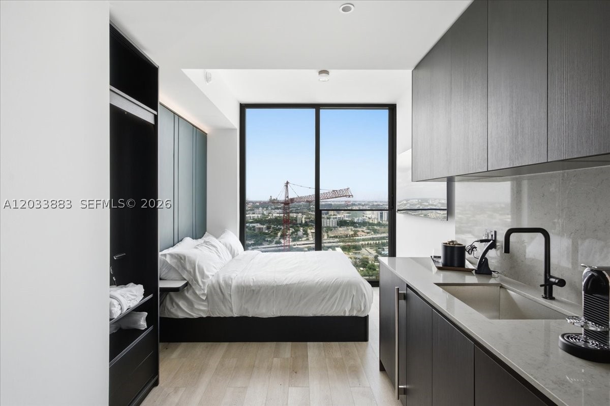 Experience elevated urban living in this fully furnished, turnkey residence at ELLEVEN Residences Miami. Located on the 42nd floor, this modern studio offers spectacular city and skyline views through floor-to-ceiling impact glass windows. Designed for flexibility and investment potential, the property allows short-term rentals with daily leasing permitted. The residence features premium finishes and a luxury kitchen. Residents enjoy world-class amenities including a multi-level resort-style pool deck, fitness center and wellness facilities, sports lounge, concierge services, and valet parking. Situated in the heart of Miami, steps from Miami Worldcenter, Kaseya Center, Brightline Station, museums, dining, nightlife, and entertainment.
