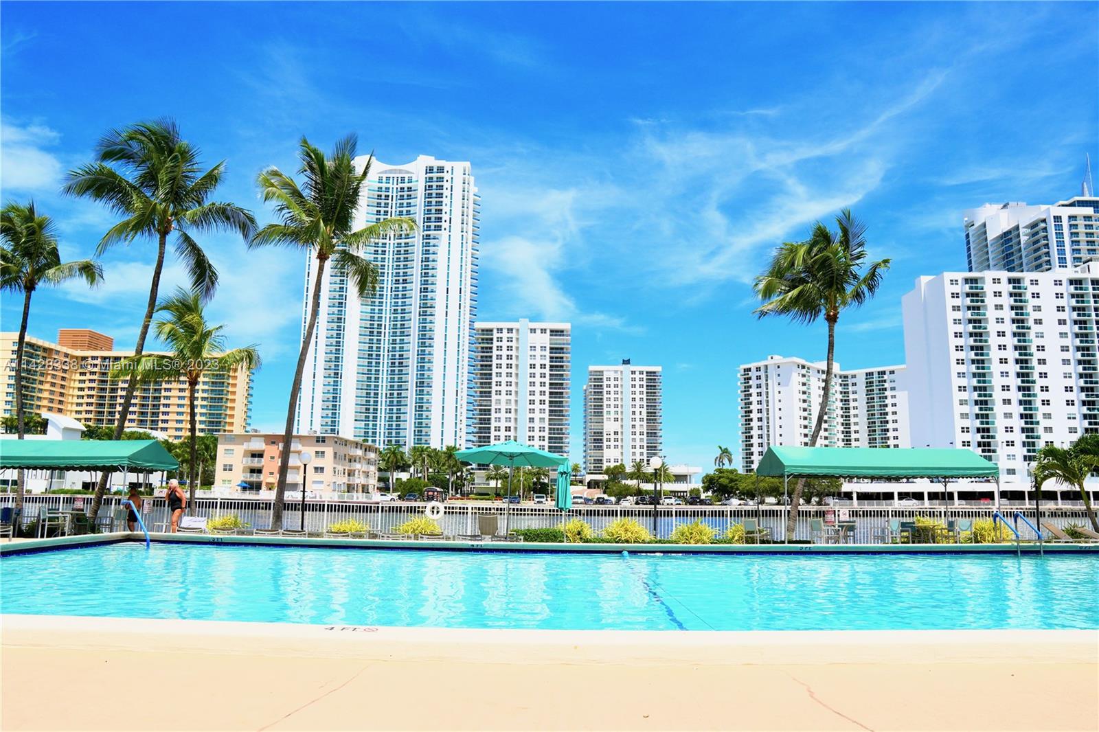 WELCOME TO THIS STUNNING 3 B/R, 2, B/A RENOVATED CORNER CONDO, IDEALLY SITUATED JUST A SHORT WALK AWAY FROM THE PRISTINE BEACHES OF HALLANDALE! THIS BEAUTIFULLY DESIGNED OVERSIZED CONDO OFFERS A TOUCH OF MODERN ELEGANCE. YOU'LL FIND SPACIOUS LIVING AREAS FLOODED W/ NATURAL LIGHT, FULLY EQUIPPED RENOVATED KITCHEN & MODERN BATHROOMS. LARGE WALK-IN CLOSET W/ BUILT-INS! STEP OUT & ENJOY THE PRIVATE WRAP AROUND BALCONY ! WITH ITS PRIME LOCATION, THIS IS YOUR DREAM CONDO, OFFERING EASY ACCESS TO THE BEACHES, SHOPPING, HARD ROCK STADIUM & HOTELS, TWO (2) AIRPORTS, I-95 & AVENTURA MALL! WALK TO THE PARK, SHOPS, DINING & HOUSE OF WORSHIP. DON'T MISS THIS OPPORTUNITY TO MAKE THIS CONDO RETREAT YOUR VERY OWN OASIS! HEATED POOL ON THE INTRACOASTAL. TENNIS COURTS, GYM, SECURITY & AMAZON LOCKER!