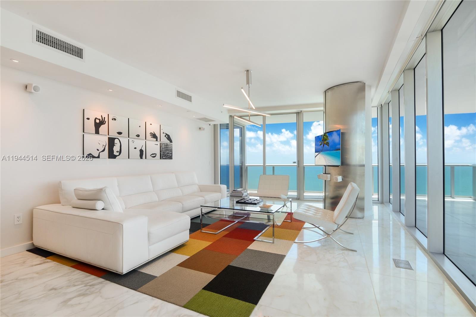 Stunning 4-bedroom residence with breathtaking ocean views. Nicely furnished. Four bathrooms + powder room. Private foyer & laundry room. Enjoy both sunrise & sunset from its two terraces. Floor-to-ceiling windows. Marble floors. Home automation system. Modern kitchen with Quartz countertop and top-of-the-line appliances (Miele, Subzero). Two parking spots. The building was designed by Carlos Ott & furnished by Fendi Casa. 5 stars amenities include a fitness center, spa, cafe, & two pools. Beach living at its best.