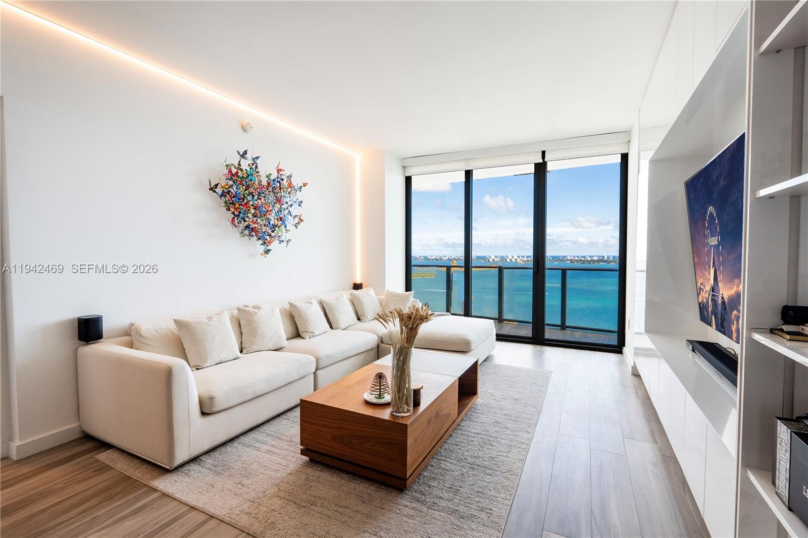 Live at one of Edgewater’s finest residences, Icon Bay. This stunning 1 bed , 1.5 bath condo showcases upgraded finishes throughout, including porcelain wood-style tile flooring that flows seamlessness onto the balcony, quartz countertops, and top-of-the-line appliances (induction stove). The home features a private elevator foyer, custom closets & built-ins, and upgraded smart-home lighting, offering both elevated design and everyday convenience. Enjoy breathtaking direct views of Biscayne Bay from the expansive private balcony, accessible from both the living space and bedroom. The residence includes 1 covered/assigned parking space on the 1st floor. Icon Bay offers five-star amenities such as 24-hour concierge and security, a bayfront pool, state-of-the-art fitness center, screening room, billiards room, library, and more—delivering luxury waterfront living at its best. Located in the vibrant Edgewater neighborhood close to shops, dining, Design District, Wynwood, Whole Foods, etc.