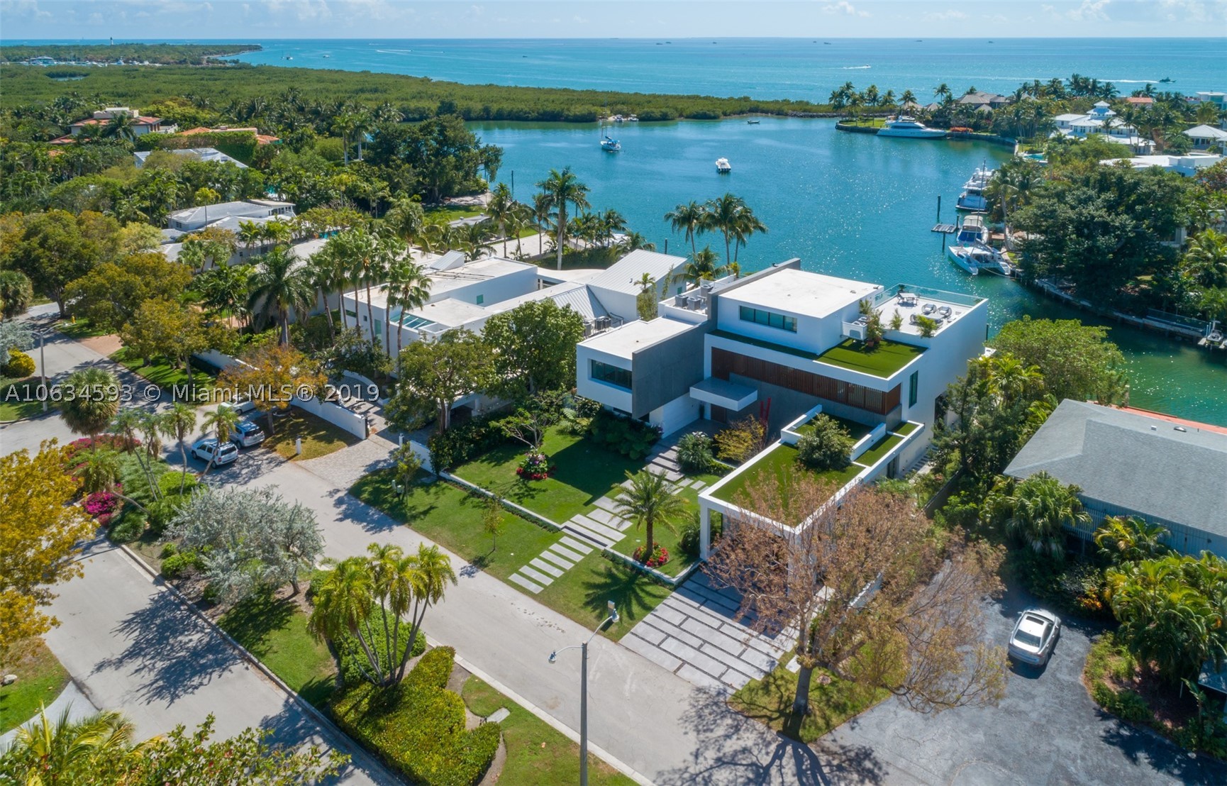 Gorgeous waterfront estate offering the ultimate level of luxury and perfection (2019). This 3 story contemporary masterpiece has been meticulously designed with exquisite architecture providing both comfort and elegance with spectacular top of the line finishes throughout. This magnificent home has very defined and open spaces with breathtaking and astonishing views of the harbor and bay. This dream residence offers an incredible infinity pool & terrace overlooking the harbor, 7 bed, 8 full baths and 1 powder room, high ceilings throughout, floor to ceiling glass windows & doors, stainless steel state-off-the-art appliances, BBQ area and on the 3rd level you will find a stunning  family room, bar and huge terrace where you can enjoy and entertain family and friends. Boaters paradise.