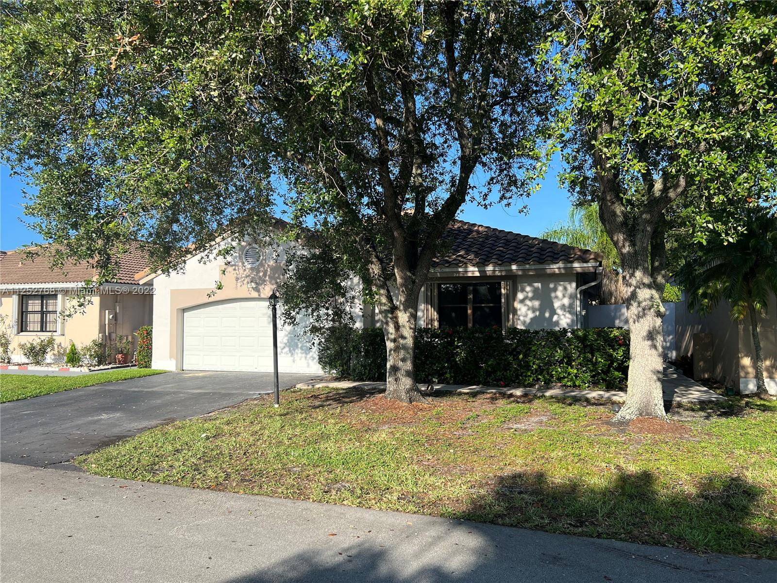 Beautiful 3/2 One Story Single Family with 2 Car Garage located in highly sought after Ivanhoe in Davie, FL.  All New Neutral Tile Flooring.  New Granite Kitchen Counter Tops with Wood Cabinets.  Renovated Bathrooms with Granite Vanity Tops.  Freshly Painted.  Screened In Patio.  No HOA approval.   New Ceiling fans in all bedrooms rooms. Community Pool.  Great Schools.  EZ access to I-75 via Griffin Road or Sheridan St.  Conveniently located to Publix Supermarkets, Parks, Cleveland Clinic, Memorial Hospitals, and Restaurants.