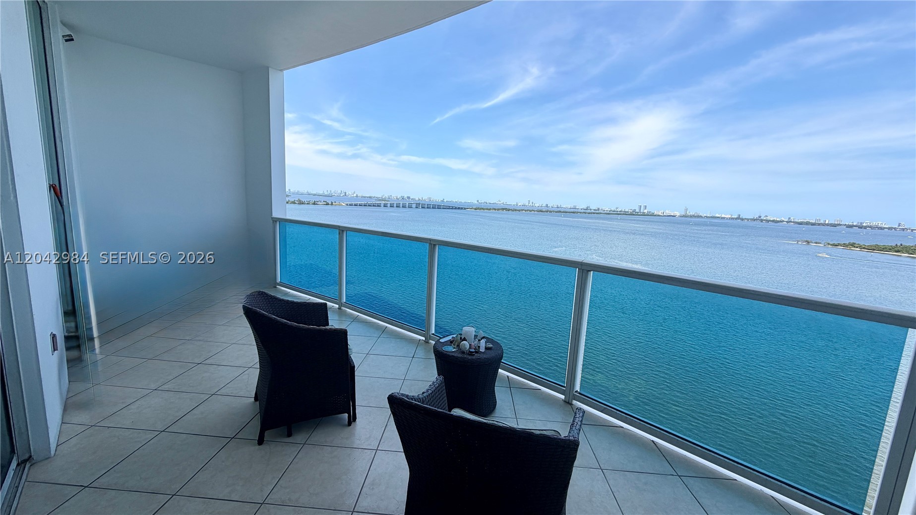 Own a view that can never be replicated at this price point. This exceptional 1-bedroom residence at New Wave Condominium offers breathtaking, direct, unobstructed views of Biscayne Bay that today command multi-million-dollar premiums in neighboring Edgewater towers. Designed by acclaimed architect Kobi Karp, this residence features high ceilings, beautiful wood floors, custom-built closets, electric shades, and an oversized private terrace that feels more like an outdoor living room overlooking the bay. Located in the heart of Edgewater, one of Miami’s most desirable waterfront neighborhoods, New Wave offers resort-style amenities including a waterfront lap pool, fitness center with cardio and strength-training equipment, meditation garden, resident lounge with water views, 24-hour concierge, 24-hour security, secured entry, valet parking, and one covered parking space included with the unit. Enjoy an unbeatable location directly across from Margaret Pace Park with tennis, basketball, and volleyball courts, while being just minutes from the Miami Design District, Wynwood, Downtown Miami, Brickell, and Miami Beach. A rare opportunity to own a true waterfront retreat with forever views in one of Miami’s most vibrant locations.