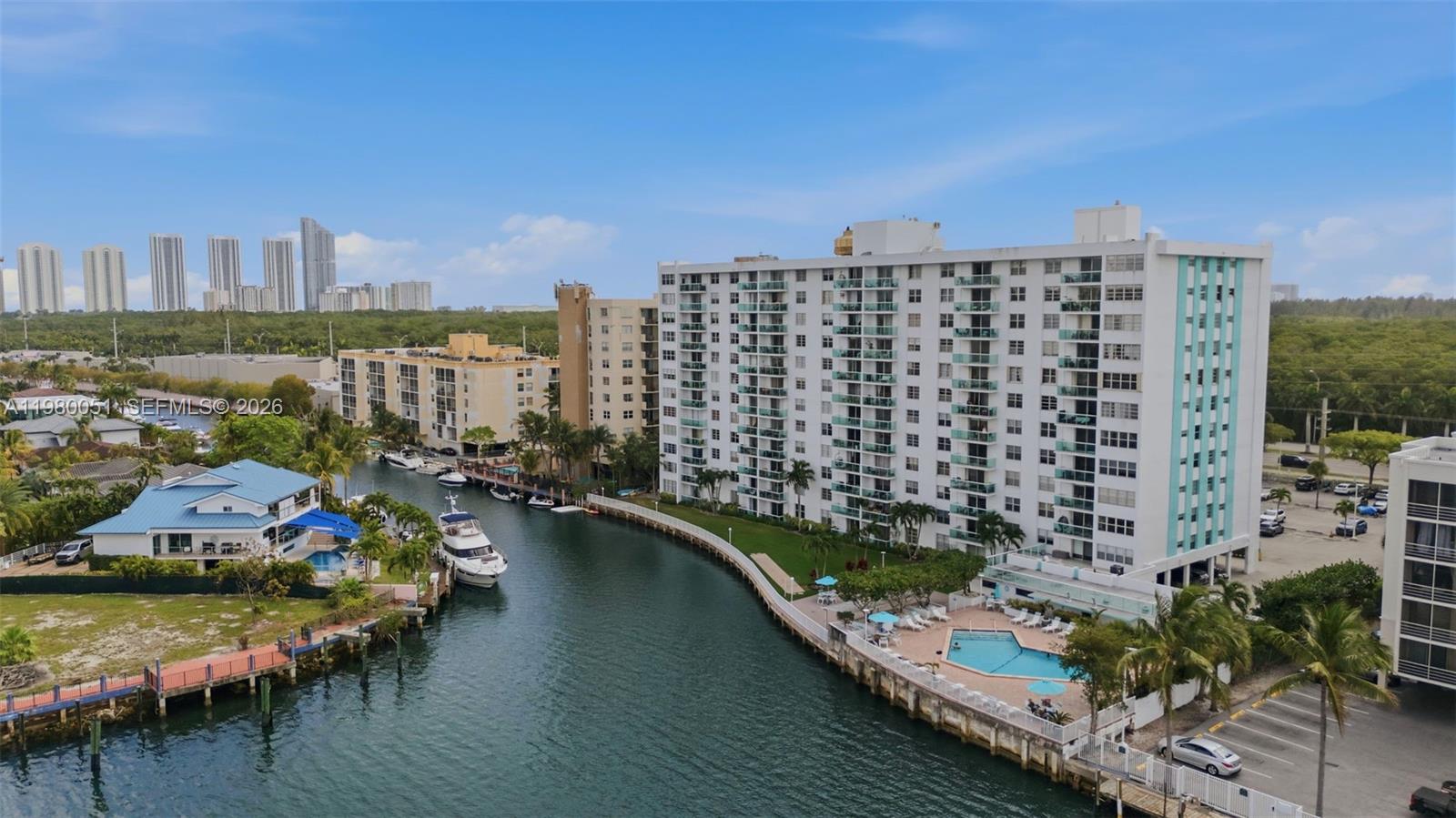 Investor/Family Opportunity: 2BR + Den (currently used as a 3rd bedroom for kid) with Oleta River views in desirable Eastern Shores. No assessments in last 2 years, strong reserves, and building recently passed 50-year recertification. Building completed concrete restoration, fresh paint & new glass balconies. Upgrades include open kitchen with granite & SS appliances, updated baths, built-out closets, new electrical panel, tankless water heater. Oversized primary, accordion shutters, 1 covered parking. Investor opportunity: Owner willing to lease back – immediate income potential. Prime location minutes to beach, Aventura, Bal Harbour, shops & dining. Easy to show.