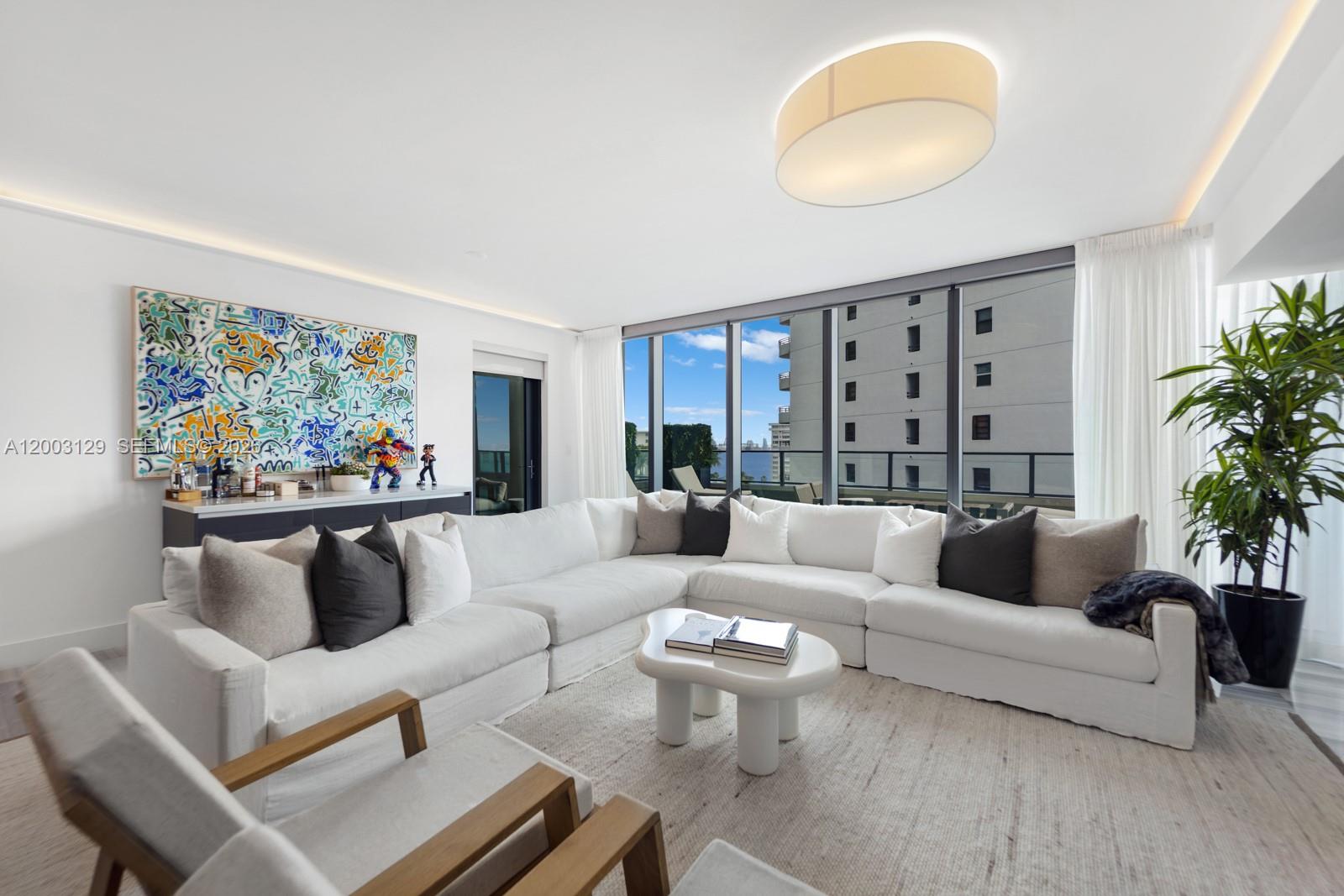 An oversized one-bedroom, 1.5-bath sanctuary, Residence 903 at Echo Brickell, designed by Carlos Ott and developed in partnership with JDS and PMG, delivers a level of scale and finish rarely found in Brickell. Spanning over 1,200 SF, the residence has been thoughtfully reimagined into a true one-bedroom retreat, featuring an expansive living area and a separate den that effortlessly functions as a private office or media lounge. Interiors are rich in texture and detail, highlighted by Venetian plaster walls, sleek marble flooring, custom ceiling lighting, and a fully integrated smart home system with wired audio and power shades throughout. The kitchen is both sculptural and functional, outfitted with premium Wolf and Miele appliances, designed for both everyday living and elevated entertaining. A defining feature is the 600 SF terrace, an outdoor extension of the home rarely seen at this scale in Brickell. Complete with a built-in BBQ, it invites seamless indoor-outdoor living, set against warm sunset light and open Biscayne Bay views. Echo Brickell offers a boutique, white-glove lifestyle with a full-floor spa and wellness level, state-of-the-art fitness center, and resort-style pool. The 44th-floor sky lounge is a true showpiece, with sweeping views of Miami Beach and a one-of-a-kind rooftop pool. Residents enjoy 24-hour concierge, complimentary pet walking, and chauffeur service.