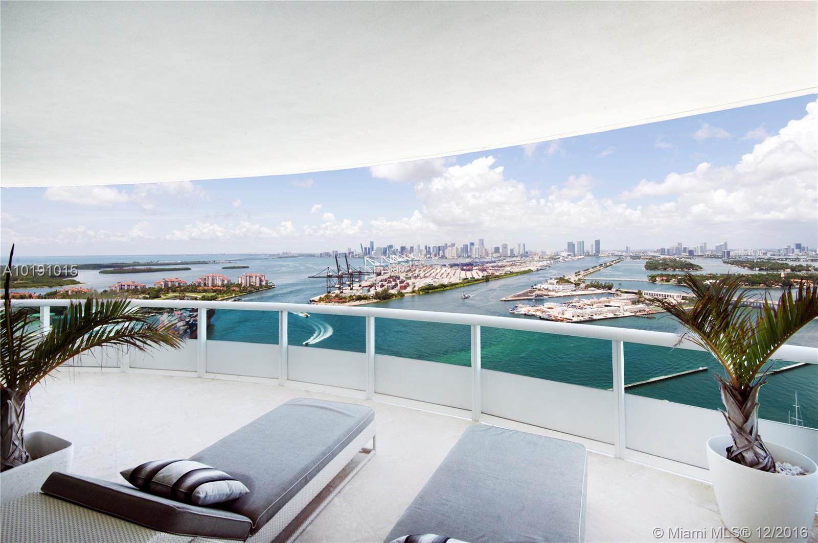 Rarely available High Floor 01 line! Considered the best line South of Fifth! Sought after for its panoramic floor to ceiling glass views, large floor plan (3365sf), spacious layout, deep 14ft oversized terraces for outdoor living, and sunrise to sunset vistas. This one of a kind 3BR/3.5BA apartment is tastefully appointed with herringbone wood floors throughout. Stunning views of the Ocean, Bay, Miami and Sobe Skylines, Port of Miami and Fisher Island. This corner residence in the sky is a must see!