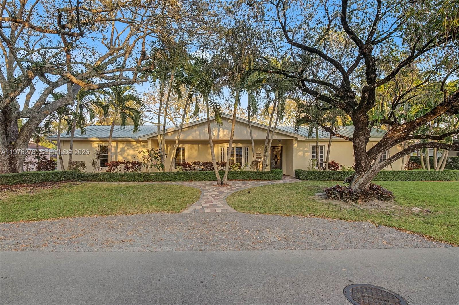 Fantastic, warm and welcoming, 5 bedroom/ 4 bath home in North Palmetto Bay. Open formal living room and dining room. Cozy family room connects to the updated kitchen with adjacent breakfast nook overlooking the pool. Spacious primary suite, bath with dual sinks, glass enclosed shower and built-in storage cabinetry. Ample-sized guest bedrooms. Separate ensuite guest bedroom perfect for an office or playroom. Some highlights include a metal roof, impact windows/doors, plantation shutters, and excellent storage closets. Fenced backyard with a variety of trees, screened pool, partially covered marble tile patio. Plus, a new hot tub to enjoy some relaxation under the stars. 1 car side entry garage, paver driveway. Located just blocks from Coral Reef Park, excellent schools.