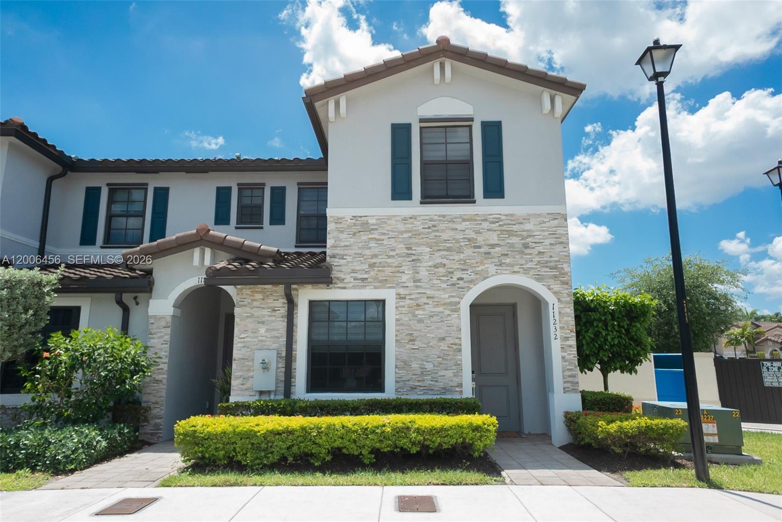 Stunning corner residence located in an exclusive gated community, offering resort-style amenities including a clubhouse, pool fitness center, and scenic walking trails. This elegant two-story home features a spacious open concept chef's kitchen, perfect for both everyday living and entertaining, ideally situated just from exit 9 on Turnpike access in Homestead, with close proximity to supermarkets, gas stations and essential services-delivering ultimate in comfort, convenience and lifestyle.
