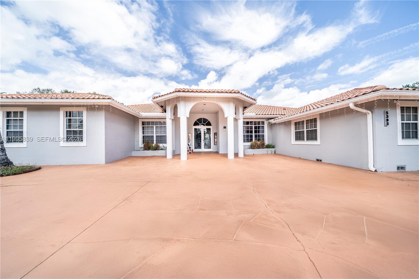 Welcome to one of Davie’s most versatile and private acre estates—located on a quiet cul-de-sac in Sunshine Acres and zoned for top-rated Cooper City schools with NO HOA.

This 5-bedroom, 5-bathroom home offers over 5,000 sq ft of upgraded living space with soaring 10–12 ft ceilings, a split floor plan, and seamless indoor-outdoor flow designed for both everyday living and unforgettable entertaining.

Inside, enjoy a fully upgraded kitchen with waterfall island, smart Samsung appliances, new epoxy flooring, designer lighting, and a renovated primary suite featuring a spa-style bathroom with a standalone soaking tub and glass-enclosed shower.

Step outside to over 3,000 sq ft of covered patio space overlooking your private pool—complete with safety fencing and baby guard—creating the perfect setting for hosting, relaxing, or even private events and gatherings.

Situated on nearly 1 acre, this property offers unmatched flexibility; fenced/gated for privacy & security, space for expansion, RV/s boats and large families, hosting/outdoor venue as well as room for horses.

Additional features include two AC units, a new well water treatment system. One bathroom remains original—giving buyers the opportunity to personalize and add value to an already upgraded estate.

Optional: Available fully furnished for a true turnkey experience.

Owner Occupied/Do Not Disturb Owner!!