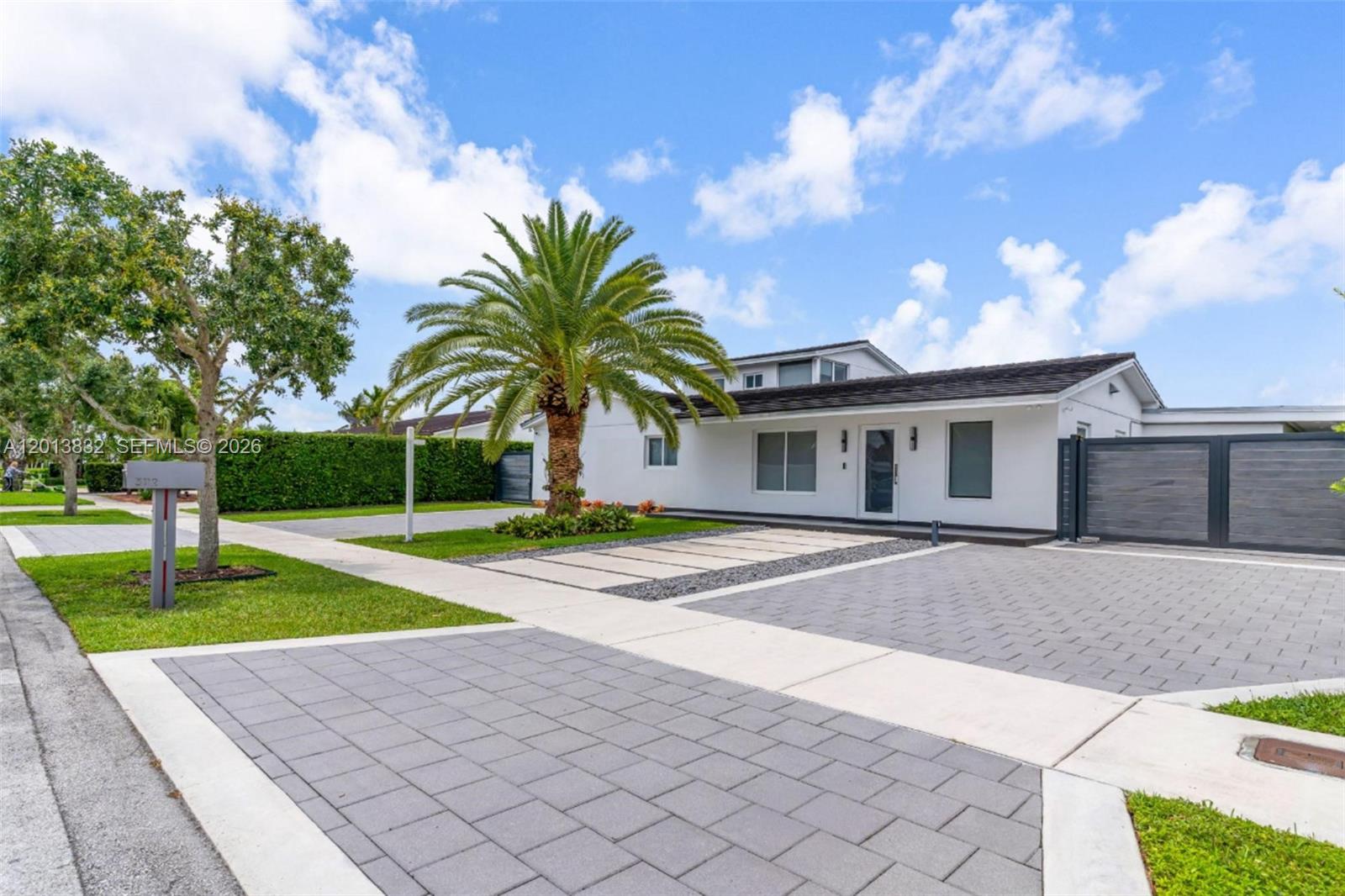 Beautifully reimagined residence in the highly desirable Village Green Estates offering a clean modern design and true indoor outdoor living. Situated on a quiet street, this home has undergone a complete high end renovation with a new tile and flat roof, impact windows and doors, updated plumbing, porcelain flooring, and spa style bathrooms finished in marble.
Designer kitchen with custom cabinetry, Calacatta quartz countertops, premium Thermador appliances, and a built in Miele coffee system. Spacious primary suite with walk in closet and a sleek rain shower bath.
The backyard delivers a true private retreat featuring a newly built 12x60 lap pool with swing up spa, heat resistant decking, and a fully automated system ideal for entertaining.
LED lighting throughout, two high efficiency AC units, gas water heater, gas range, gas dryer, and generous parking. Move in ready with exceptional finishes throughout.