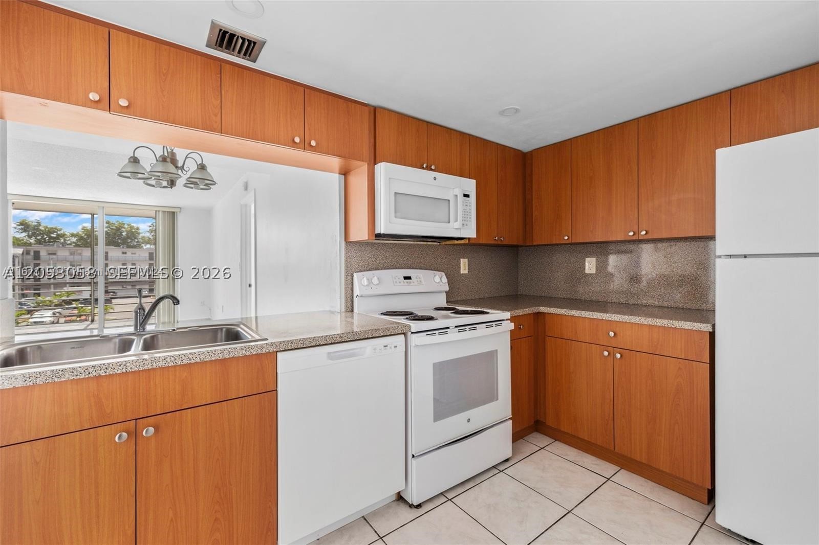 Check out this 3 bedroom, 2 bathroom condo apartment located in the heart of Miami. This spacious and well-maintained unit features a modern kitchen with white appliances, granite countertops, and plenty of cabinet space. The living and dining areas are bright and open, perfect for entertaining guests or relaxing with family. The master bedroom includes a walk-in closet and en-suite bathroom, while the two additional bedrooms offer ample space and natural light. Enjoy the convenience of a washer and dryer in the building and a screened private balcony . The complex also includes a pool, gym, and clubhouse for residents to enjoy.