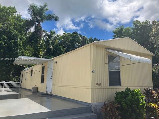 Priced to sell!  Home is neat, clean, and move-in ready.  It features a cozy split floor plan with a large outdoor patio and has been well-maintained.  There are 2 parking spaces along with a spacious yard.  You will own the land, have a low HOA fee, and there are financing options currently available.  Do not miss out on this opportunity to own your own home.  Please call the agent!