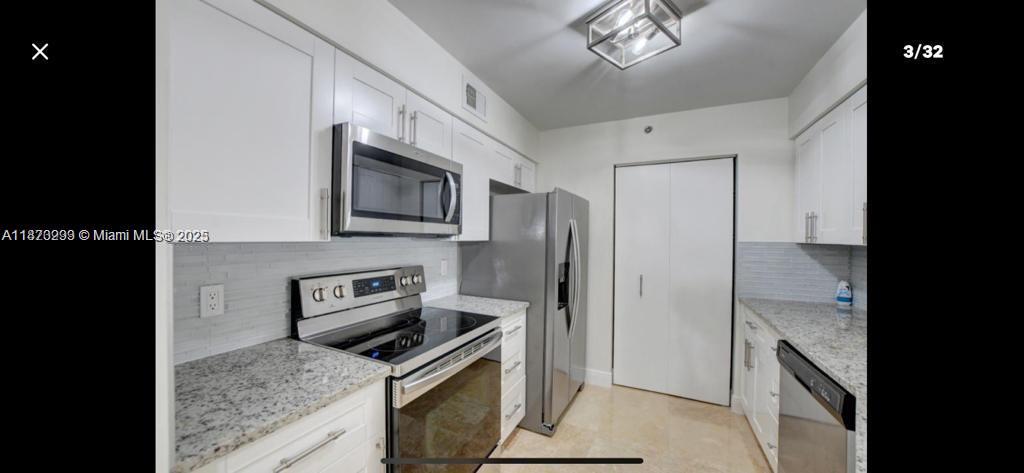Amazing 3 bedroom 2 bath condo, fresh painting in a  24 hour guard gated community. This first story condo has a stainless steel appliances, granite kitchen countertops, custom closets, and laminate floors in the three bedrooms, and marble floors in living areas. Very well maintained community, landscaping and security. Tennis court and playground for children, heated pool and spa, fitness center and clubhouse. Close to Town Center Mall and few minutes from the beach.