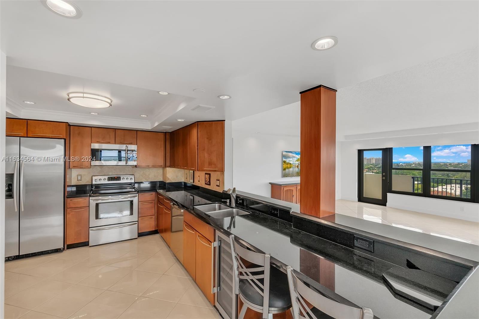 A TASTEFULLY RENOVATED RENTAL like this is rarely on the market! CORNER UNIT WITH WRAP-AROUND BALCONY and OCEAN, MARINA and TENNIS COURT VIEWS. Modern OPEN kitchen with lots of cabinets and lovely stainless appliances off a spacious living area with separate LARGE dining space. The primary bedroom has a large stunning ensuite with a HUGE walk-in closet. The guest bedroom is large with lots of closets too. WASHER/DRYER in unit. 24-hour guards. Indoor-covered parking. Heated pool, tennis courts, gym, library/card room, and BBQ area overlooking the marina. Wi-Fi and CABLE are included. Walking distance to restaurants and shopping. NO pickup trucks for now! EV chargers are planned. EASY TO SHOW! HURRY!