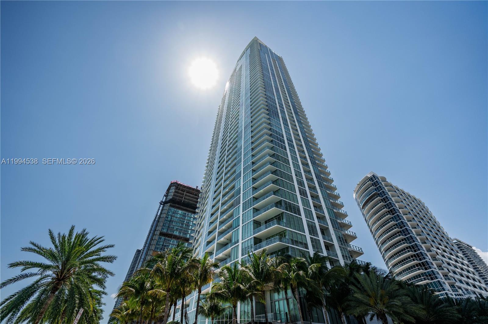Experience luxury waterfront living at Biscayne Beach in this fully furnished, turnkey residence that shows like a model home and offers unobstructed water views.Lightly used as a second home, this unit presents minimal wear and is in pristine condition, making it a rare opportunity for buyers seeking a true turn-key, move-in ready property with exceptional value.The residence features Crema Marfil marble flooring, electric curtains and blackout shades throughout, designer custom lighting throughout the entire apartment, and custom California Closets, combining elegance, functionality, and high-end design. Floor-to-ceiling windows enhance natural light while framing the stunning open bay views.Offered fully furnished and completely turnkey, this residence is ideal for end-users, or as a perfect second home, providing a seamless acquisition with no additional work required.Located in the prime, high-end area of Edgewater, this residence offers immediate access to the best of Miami while maintaining a private waterfront setting. Enjoy resort-style amenities, direct bayfront views, and a prime location just minutes from Downtown Miami, Brickell, Wynwood, and the Design District and minutes away from airport.