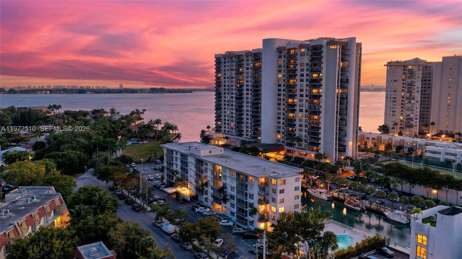 Top floor unit with amazing views, including water views! 2 bedroom and 2 full bathrooms, split floor plan for maximum privacy and enjoyment, over sized enclosed balcony and 2nd open corner balcony. NEW impact windows! Exterior storage included. Fitness room. Strong reserves. Building has new ROOF, New POOL, Pool DECK, pump room, Concrete restorations, New Exterior paint job. NEW Seawall. New Flooring (carpet) in building hallways (all aforementioned items performed within the past 3 years!)