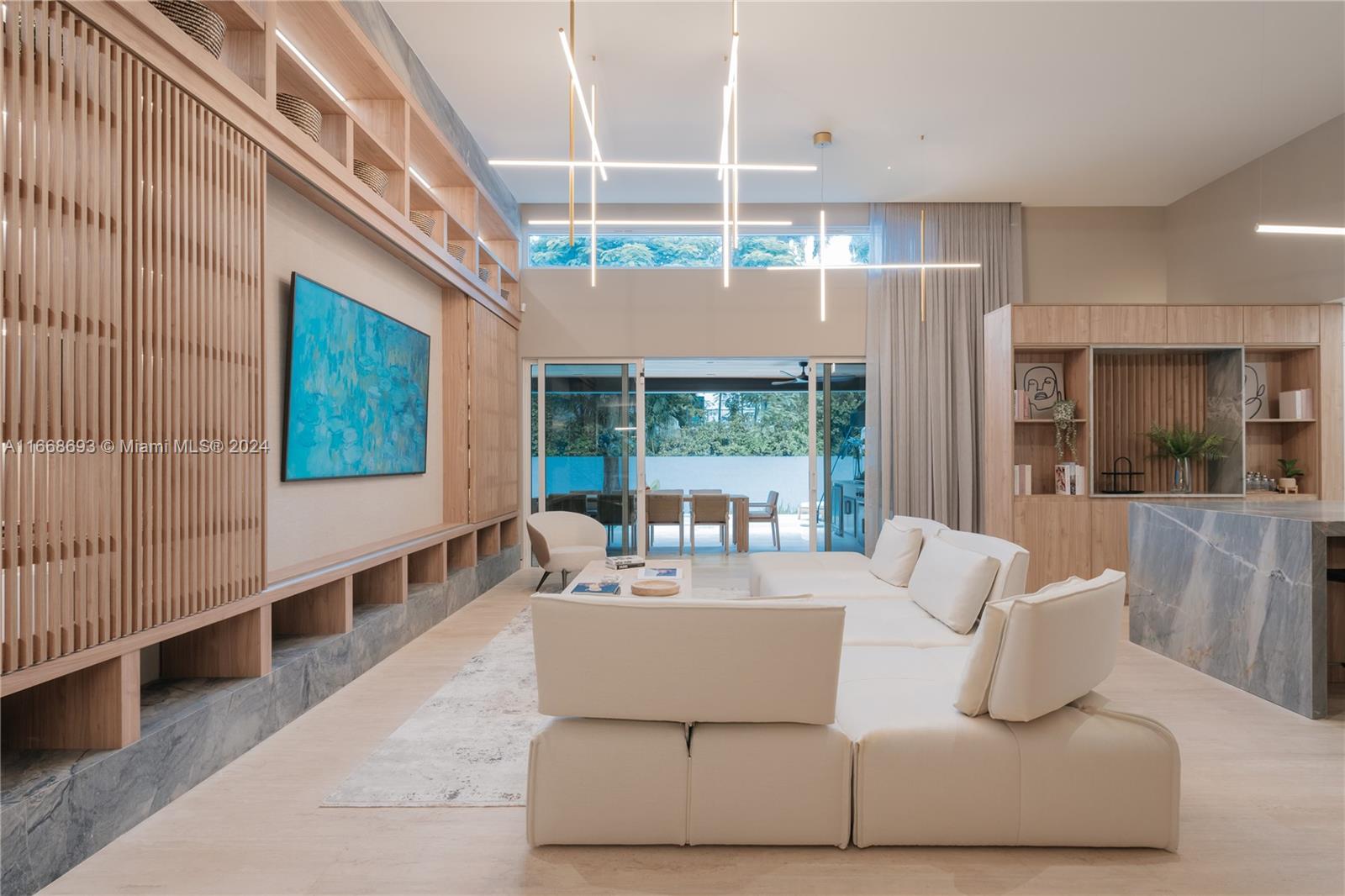 Welcome to this stunning fully remodeled 4-bed, 4-bath home with 3,341 sq ft of living space on South Miami Avenue, just minutes from Brickell. Move-in ready and delivered fully furnished, it features an open-concept layout filled with natural light and a double-height ceiling in the living room. The gourmet kitchen is equipped with top of the line appliances, while engineered wood floors enhance the bedrooms. Elegant Ivory Travertine Marble graces the social areas, and the bathrooms showcase Travertine  Marble, Calacatta Marble, and Mont Blanc Onyx. The home also features a Lutron system and custom millwork throughout. The terrace is perfect for entertaining, with Taj Mahal Onyx finishes. A resort-style pool, barbecue area, and two-car garage complete this exceptional property.