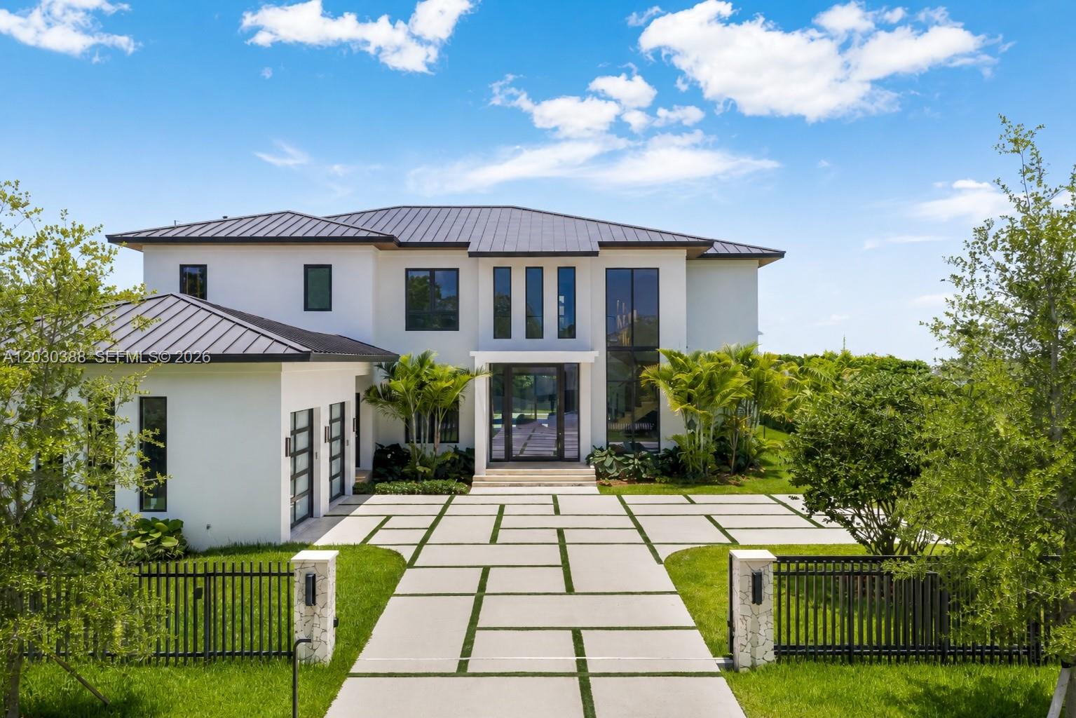 A rare opportunity to own brand-new construction home on an oversized 17,571 SF lot in the coveted South Miami/Snapper Creek neighborhood. Privately positioned at the end of a residential street, this stunning contemporary estate showcases premium finishes and offers 5,226 SF under A/C with 6 bedrooms, 7.5 baths plus additional office.

A dramatic double-height foyer and impressive pivot entry door introduce expansive living spaces drenched with natural light, designed for both everyday family living and grand-scale entertaining. The chef's kitchen features premium appliances, double ovens, custom cabinetry, and a temperature-controlled wine cellar. Pocket impact doors create seamless indoor-outdoor living, opening to an oversized covered terrace, cabana bath, fire pit lounge, and spectacular saltwater pool and spa.

The luxurious primary suite serves as a private retreat with a spa-inspired bath and oversized custom his-and-her closets. Additional highlights include custom closets throughout, Control4 smart home integration, upstairs/downstairs laundry rooms, direct city gas connection, elevator-ready design with downstairs den and staff quarters. 

Surrounded by many of the area's finest newer residences and ideally located to top public and private schools, Downtown South Miami, Coral Gables, Coconut Grove, and Brickell, this exceptional residence offers a rare combination of location, scale, privacy, and lifestyle in one of Miami's most desirable neighborhoods.