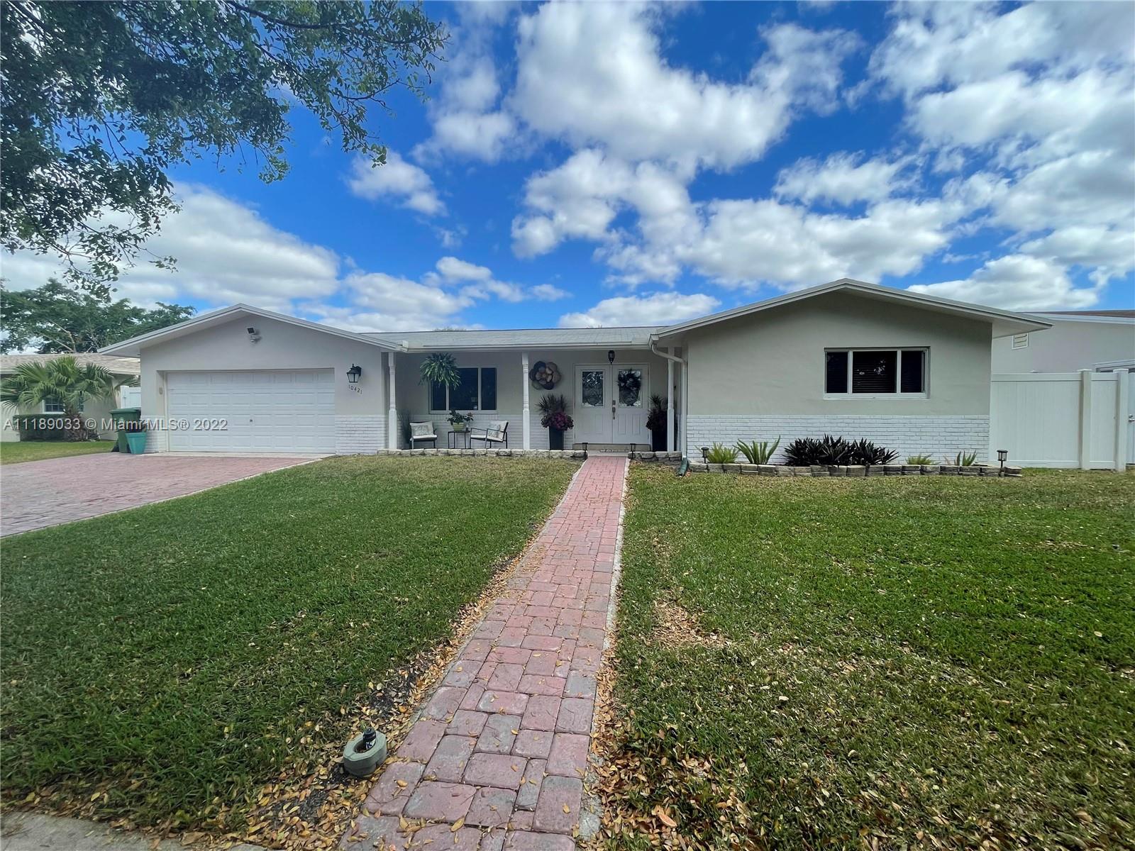 A well-maintained gem in the heart of Pembroke Pines! This beautiful three-bedroom, two-bath home boasts many desirable finishes and updates throughout. The open-concept floor plan is both inviting and practical for entertaining.  Well-equipped kitchen lined with tall white cabinets, stainless appliances, and granite counters. 

Guests will rave over the perfect fenced-in yard with lush green turf and stunning landscaping.The volleyball style in-ground pool and surrounding patio will be the talk of the party as guests take advantage of the space or recline under the space of the covered patio and bar area.