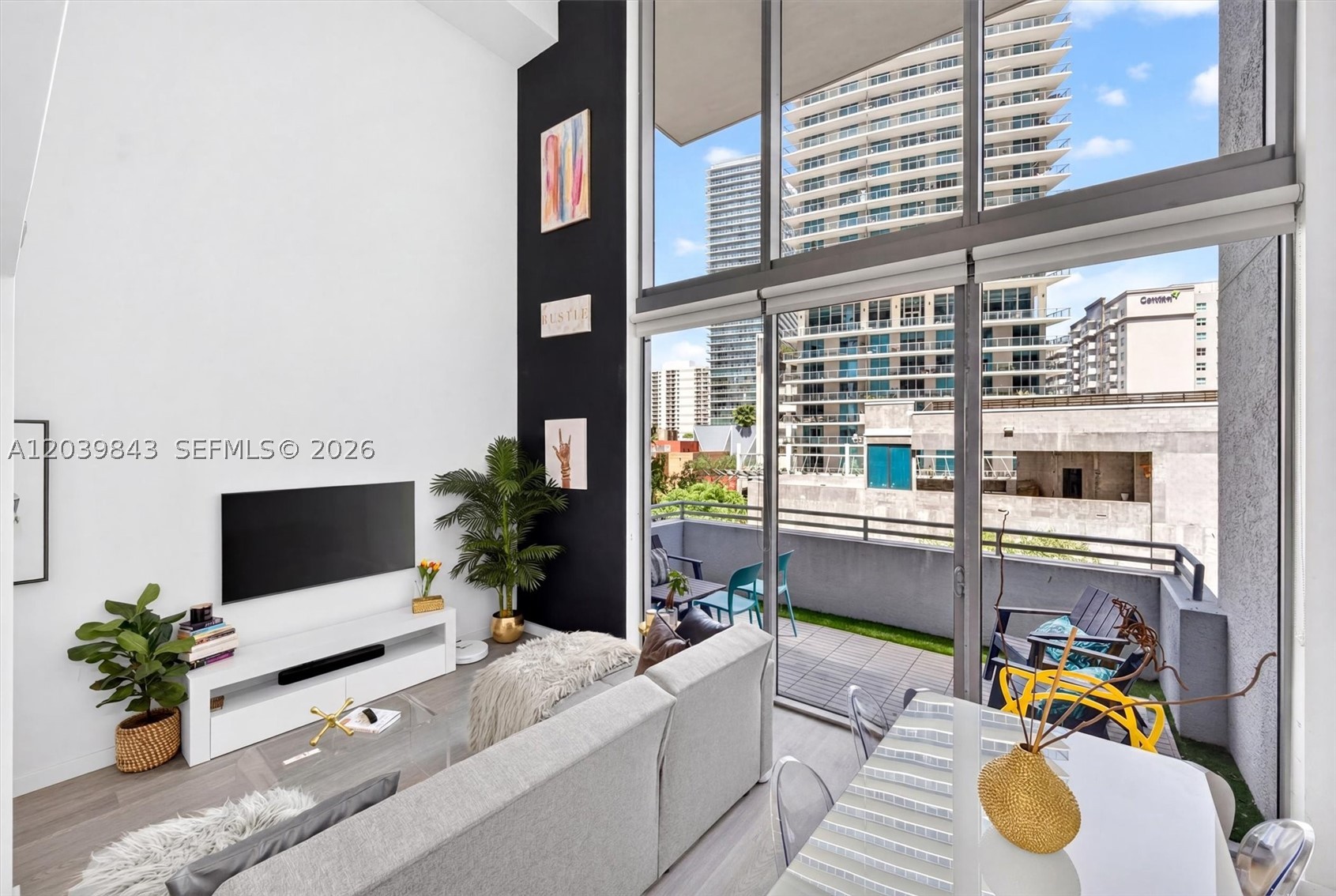 Experience elevated urban living in this stunning two-story luxury loft at 1050 Brickell Avenue, ideally located in the heart of Brickell. Residence #420 showcases dramatic 20-foot ceilings and expansive floor-to-ceiling windows that flood the home with natural light, creating an impressive open-concept living space. The modern loft design seamlessly blends sophistication and functionality, featuring spacious living and dining areas, contemporary finishes, and a thoughtfully designed two-level layout that offers both privacy and style. Enjoy the vibrant Brickell lifestyle with world-class dining, shopping, entertainment, and business centers just steps from your door. A rare opportunity to own a distinctive luxury loft in one of Miami's most sought-after neighborhoods. Steps from Mary Brickell Village and Brickell City Center with endless shopping and dining opportunities.