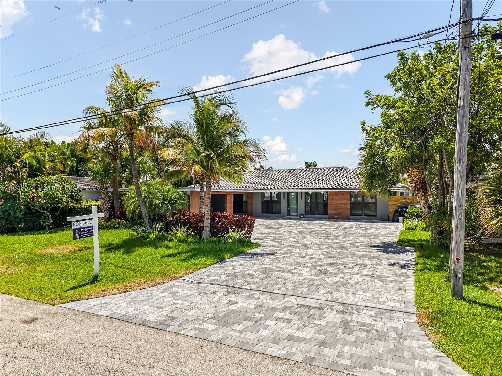 Welcome to this stunningly remodeled waterfront retreat in the heart of Wilton Manors! Featuring modern finishes, abundant natural light, and an open-concept design, this home is a perfect blend of elegance and comfort. Enjoy ocean access from your backyard, ideal for boating enthusiasts, or simply relax in your lush backyard oasis with serene water views. The entire backyard is TURF! Owner invested in landscaping. Inside, you'll find high-end designer finishes, a sleek gourmet kitchen with prep island, spa-inspired bathrooms, and spacious living areas perfect for entertaining. Home was rebuilt top to bottom in 2023-2025: roof, AC, electric, impact windows, new pool. All renovations done with permits.
