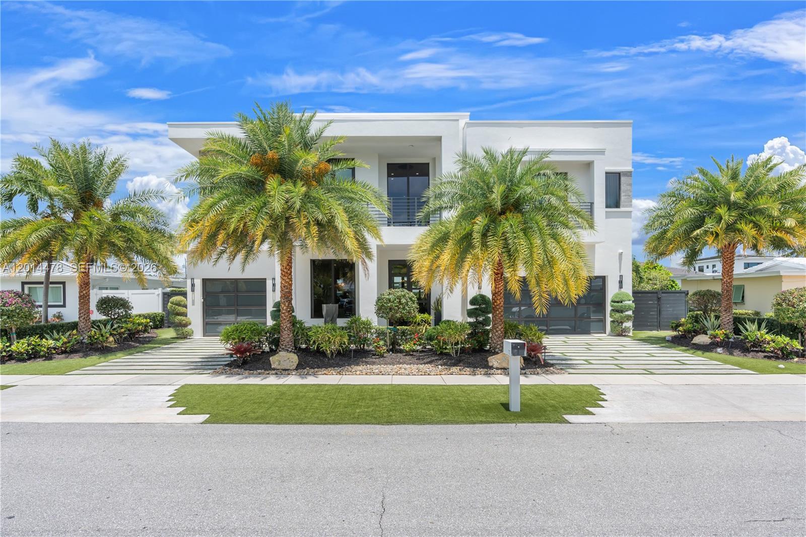 Impeccably renovated waterfront estate offering deepwater ocean access with 80 feet of frontage and no fixed bridges. Custom-designed interiors showcase elevated finishes, tailored millwork, a beautifully renovated primary suite, reimagined bathrooms, and a thoughtfully updated kitchen that connects seamlessly to both interior and exterior living spaces. Resort-style living continues outside with a travertine pool deck, a motorized louvered pergola, and a fully appointed outdoor kitchen. Additional highlights include a whole-house generator, outfitted garage with slatwall storage, and porcelain exterior wall cladding. Prime East Boca Raton location with access to acclaimed restaurants, shopping, and entertainment in Boca, Delray Beach, West Palm & Palm Beach.