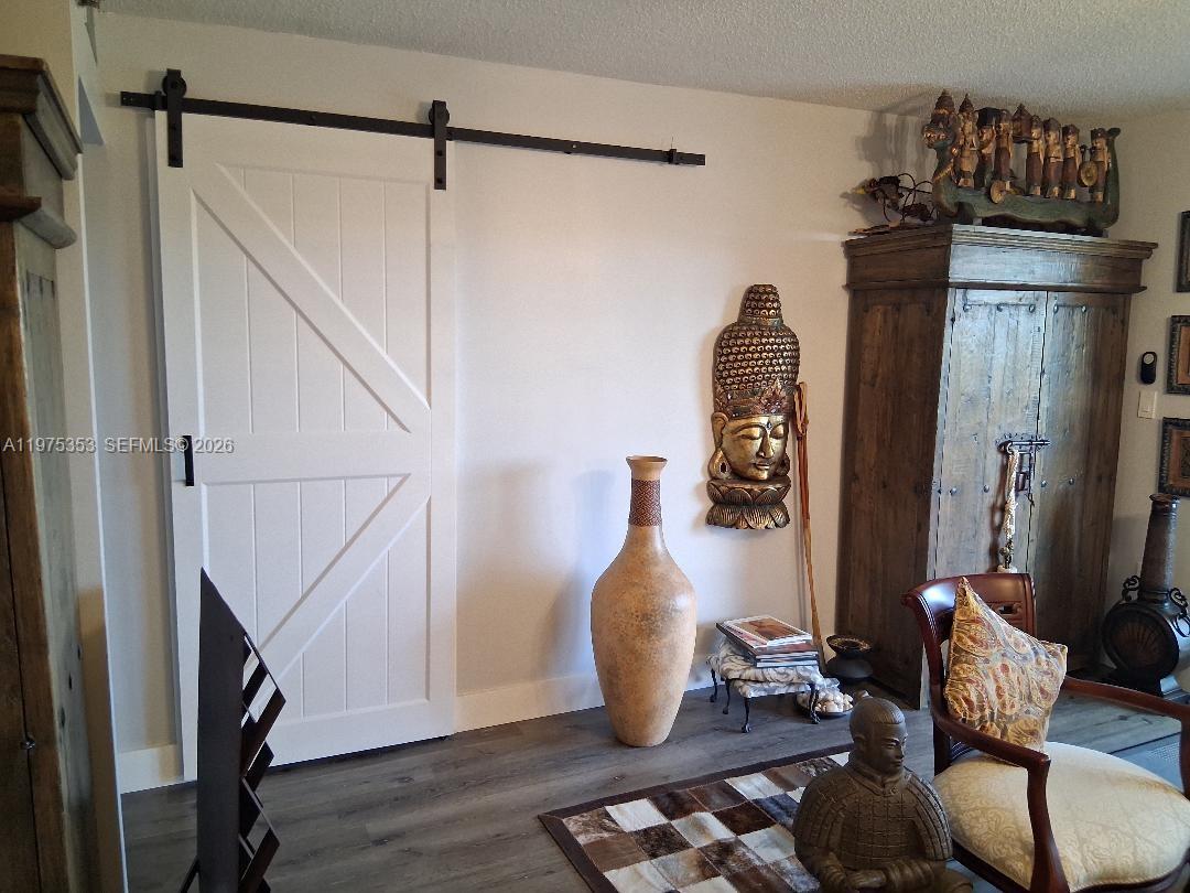 Just Beautiful...Renovated Kitchen and Baths...Stainless Steel appliances...Gorgeous flooring thru out...Pool view...1295 sf...This is what you call a home...Dining and Primary fixture doesn't convey but will be replaced...Second Bdrm w/Barn door...Tank-less wht...Tiled Patio...Assoc requirements are 20% down, Minimum 700 CS and No Pets...