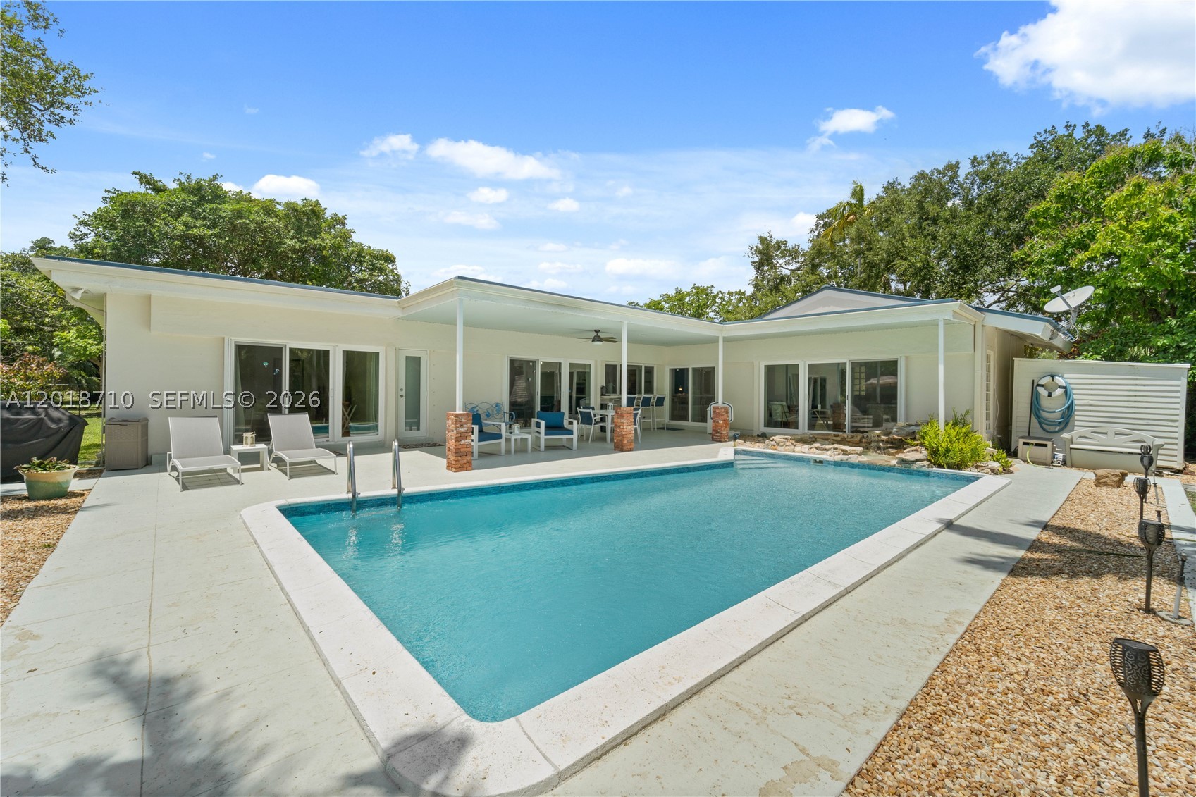 Experience refined living in this exceptional residence in Cutler Bay, gracefully positioned near a quiet cul-de-sac on an impressive 17,160-square-foot lot. Thoughtfully curated with sophisticated finishes and timeless design elements, this home offers an unparalleled blend of comfort and elegance.
The heart of the home is a beautifully appointed chef’s kitchen featuring quartz countertops, premium stainless steel appliances, and seamless flow into the expansive living spaces. Dramatic wood-beam ceilings soar above the main living area, while designer lighting and a well-conceived floor plan create an atmosphere that is both inviting and elevated.
Step outside into your own private oasis, where lush tropical landscaping surrounds a sparkling pool designed for effortless entertaining and serene outdoor living. Recent enhancements include a sleek aluminum roof installed approximately three years ago, as well as imported Chicago brick detailing that adds character and distinction to both the front and rear exterior spaces.
Ideally located near Palmer Trinity School and moments from Old Cutler Road, this remarkable property offers convenience, prestige, and privacy — all without the constraints of a homeowner’s association.
A rare offering that captures the essence of South Florida luxury living. Private showings available by