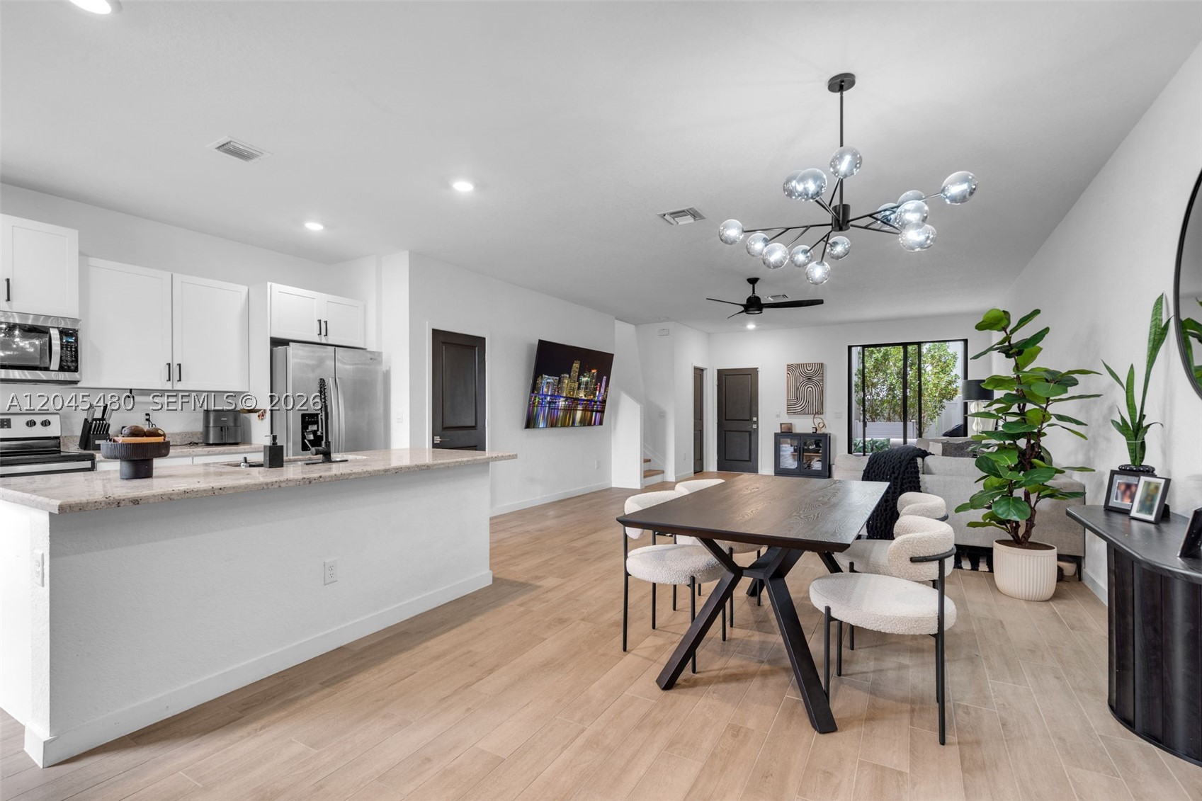 Welcome to this beautifully upgraded 2022 fee simple townhome in the desirable Gardenia Park community. Offering nearly 1,900 SF with 3 bedrooms and 2.5 bathrooms, the owner has thoughtfully updated the home throughout, creating a truly turnkey opportunity. Features include an open-concept floor plan, 10-foot ceilings, wood-look tile flooring, impact windows and doors, quartz countertops, white shaker cabinetry, stainless steel appliances, a spacious 1-car garage, paver driveway, and private fenced patio ideal for relaxing or entertaining. Residents enjoy a community pool with cabana and low HOA fees. Ideally located just minutes from Downtown Fort Lauderdale, Las Olas Boulevard, shopping, dining, major highways, Fort Lauderdale-Hollywood International Airport, and the beach, this home offers the perfect blend of modern style, convenience, and South Florida living.