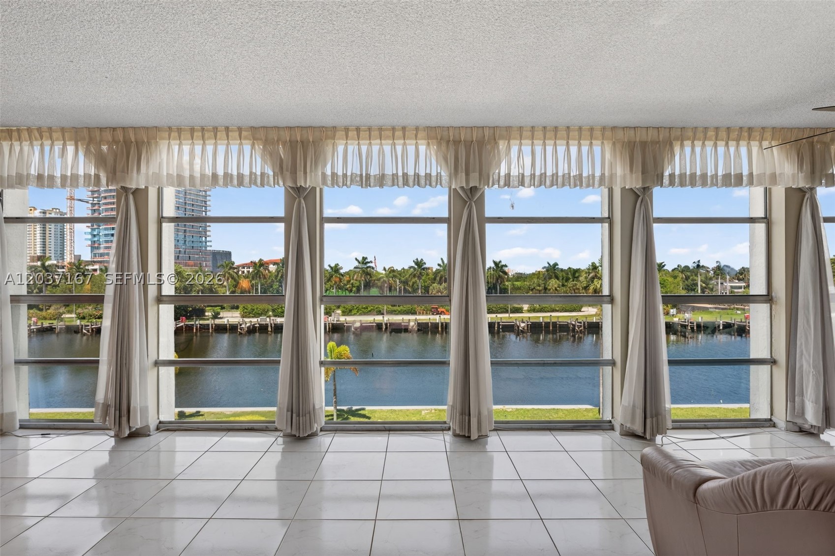 EXCEPTIONAL OPPORTUNITY FOR INVESTORS AND END USERS ALIKE!  RARELY AVAILABLE, THIS LARGEST AND SPECIOUS 2-BEDROOM, 2-BATH RESIDENCE WITH A DEN-OFFICE/3RD ROOM IS IDEALLY LOCATED IN THE HEART OF HALLANDALE BEACH.   ENJOY UNOBSTRUCTED VIEWS OF THE CANAL, WATERWAYS & DIPLOMAT MARINA THROUGH FLOOR-TO-CEIILING WINDOWS THAT FILL THIS HOME WITH NATURAL LIGHT.   THE DESIRABLE SPLIT-BEDROOM LAYOUT WITH 2 PRIVATE BALCONIES CREATES THE FEEL OF TWO SEPARATE SUITES – PERFECT FOR PRIVACY AND FLEXIBLITY.   THIS BRIGHT AND AIRY CONDO FEATURES GREAT LIVING AREA, 2 WALK-IN CLOSETS, PLANTY OF STORAGE, AND INCREDABLE POTENTIAL TO CUSTOMIZE AND MAKE IT OWN!   RESIDENCE ENJOY A HEATED WATERFRONT POOL WITH SPECTACULAR SUNSETS, TENNIS COURT, CLUBHOUSE, SAUNA, FREE GUEST PARKING, STORAGE AND LAUNDRY ON EVERY FLOOR.  CONDO SITUATED DIRECTLY ACROSS FROM JOSEPH SCAVO PARK FEATURING A CHILDREN’S PLAYGROUND AND WALKING PATHS.  JUST A SHORT WALK TO THE BEACH, RESTAURANTS, SHOPPING, WITH CONVINIENT ACCESS TO AVENTURA MALL, CASINOS, AND FORT-LAUDERDALE AIRPORT.  THIS UNIT OFFERS IMMEDIATE RENTAL!  PERFECT COMBINATION OF SPACE, VIEWS, LOCATION & VALUE!
