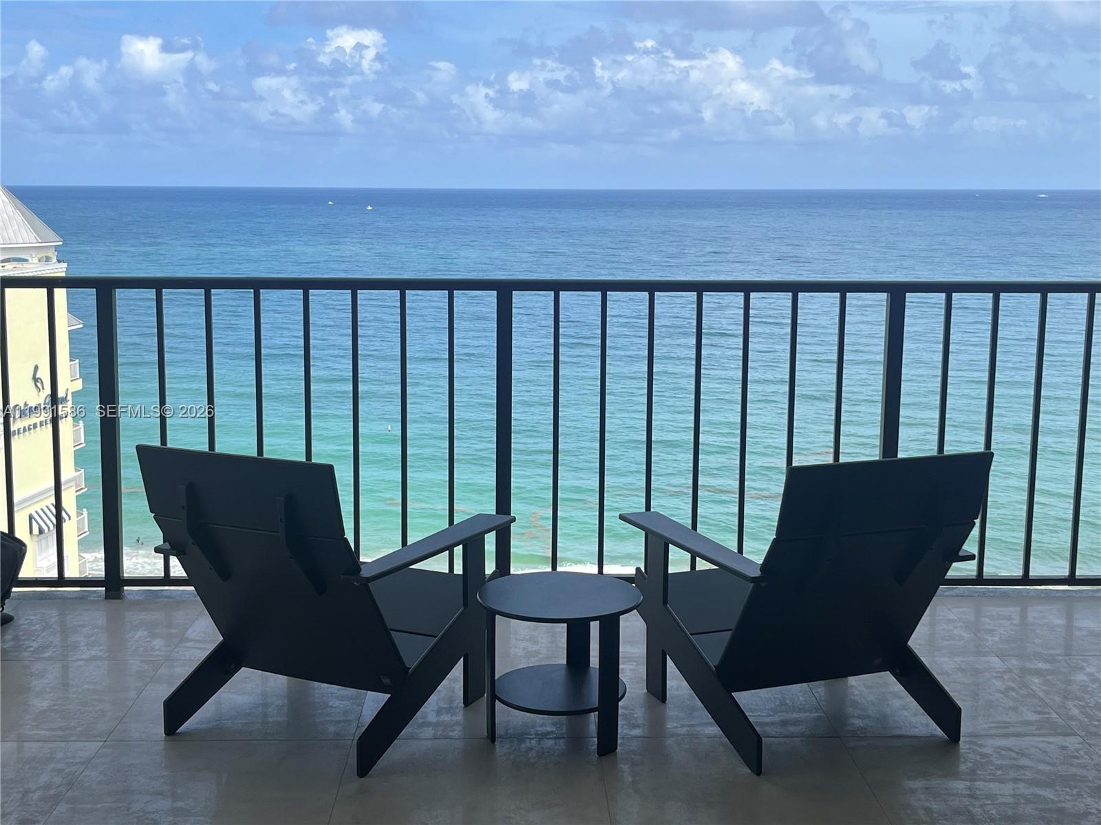 Northeast corner flow-through direct ocean Penthouse unit w/semiprivate elevator offers complete privacy & spectacular direct ocean,intracoastal & vibrant city views.Total elegant & contemporary remodel w/high end finishes.Gourmet custom kitchen large capacity pantry;drawer microwave;large peninsula with induction cooktop & counter seating.Coffee/Bar station w/cooler.Master bath features TOTO Washlet, two solid wood vanities w/built in outlets.Oversized curb less,zero-threshold walk in shower.In unit washer/dryer.Tiled throughout void of transitions.Enlarged master bedroom Swedish ELFA customizable walk-in closet system.Privatized access guest suite. Solid wood doors w/EMTEK hardware,LED dimmable soffit & overhead lighting throughout.Solar shades.Porcelana tiles in both bathrooms.Impact windows & doors.Large balcony with stunning sunrise & sunset vistas.Resort style development offers oceanfront clubhouse, heated pool, complimentary beach chairs,hot tub,newly remodeled gyms (cardio/weight), grilling gazebo, kayak/board storage, ample guest parking.  Internet, cable & 24/7 security included in asso. fee. Assigned premium garage parking space in walled alcove adjacent to climate controlled storage away from exposure yet close to elevator.Hugh Taylor State Park close by. EV charging stations & Amazon HUB on site.Financially secure development conforming to SIRSS including ELSS.Two+ year project near completed.All Special Assessments paid by Seller. Owner financing available.