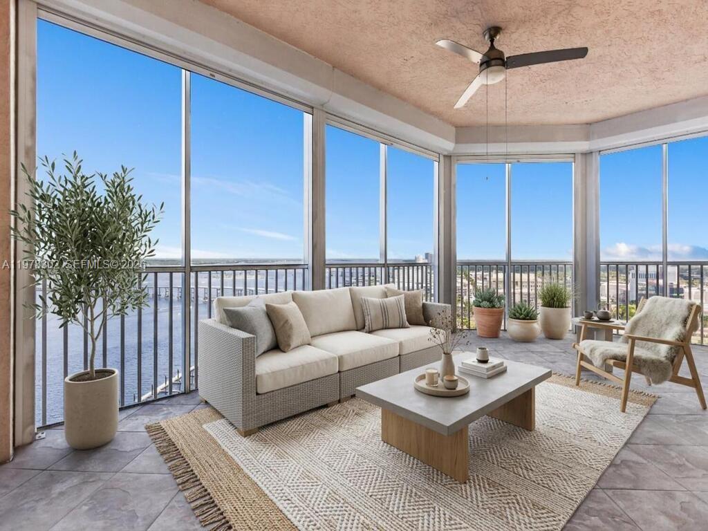 Experience coastal luxury in this 23rd floor corner sky residence with sweeping penthouse-level water views of the Caloosahatchee River, Downtown Fort Myers, and the cityscape, offering a front-row seat to Southwest Florida sunsets. Filled with natural light, the home features two bedrooms plus a versatile den that can serve as a third bedroom or office. High ceilings, wood flooring, and crown molding enhance the open living spaces, while floor-to-ceiling windows frame breathtaking views. The primary suite offers private balcony access, a five-piece bath, and a generous walk-in closet. Step onto the expansive waterfront terrace or enjoy the screened balcony with powered hurricane shutters. The gourmet kitchen, refined living spaces, and abundant storage including air-conditioned units combine practicality with style. Pet-friendly building with impact windows, secure access, private elevator, and resort-style amenities including a riverfront pool and spa, fitness center, library, and gathering spaces. Walk to the Downtown River District, Caloosa Sound Amphitheater, parks, restaurants, shopping, and the marina. Rental-friendly with seasonal and snowbird potential. Seller financing available.