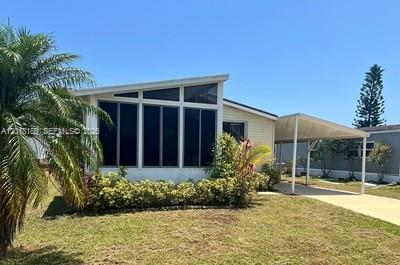 Well maintained land-owned 2 bedroom, 2 bathroom manufactured home located in the sought-after Savanna Club community in Port St. Lucie! This spacious home features tile flooring throughout, a formal dining room, and an open kitchen overlooking the dining area, living room, and screened lanai, perfect for entertaining or relaxing year-round. The primary suite offers a walk-in closet and private bath, while the covered carport includes a convenient storage/workshop area for extra functionality. Enjoy resort-style living with outstanding community amenities including golf, tennis, pickleball, clubhouse, fitness center, and more. Conveniently located near shopping, dining, medical facilities, and Treasure Coast beaches. Don’t miss this opportunity to enjoy the Florida lifestyle in one of the area’s most desirable active adult communities! All information recorded in the MLS is intended to be accurate but cannot be guaranteed, buyer advised to verify.