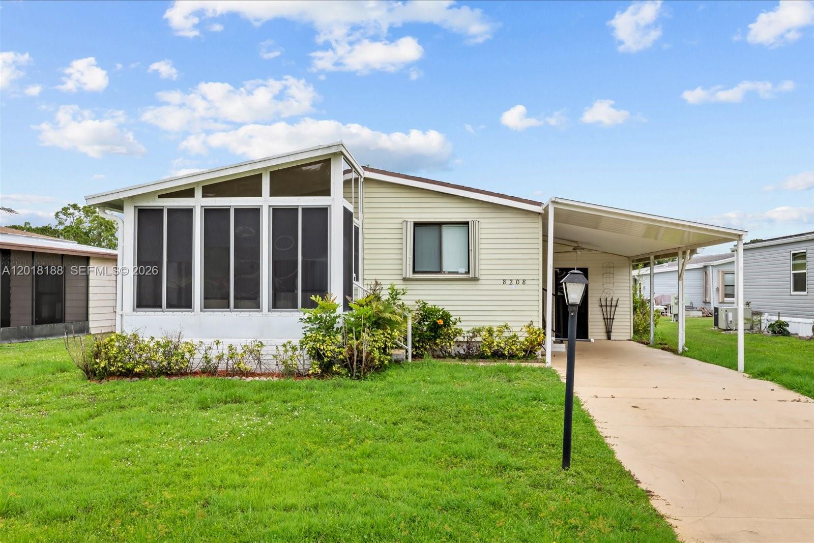 Well maintained land-owned 2 bedroom, 2 bathroom manufactured home located in the sought-after Savanna Club community in Port St. Lucie! This spacious home features tile flooring throughout, a formal dining room, and an open kitchen overlooking the dining area, living room, and screened lanai, perfect for entertaining or relaxing year-round. The primary suite offers a walk-in closet and private bath, while the covered carport includes a convenient storage/workshop area for extra functionality. Enjoy resort-style living with outstanding community amenities including golf, tennis, pickleball, clubhouse, fitness center, and more. Conveniently located near shopping, dining, medical facilities, and Treasure Coast beaches. Don’t miss this opportunity to enjoy the Florida lifestyle in one of the area’s most desirable active adult communities! All information recorded in the MLS is intended to be accurate but cannot be guaranteed, buyer advised to verify.