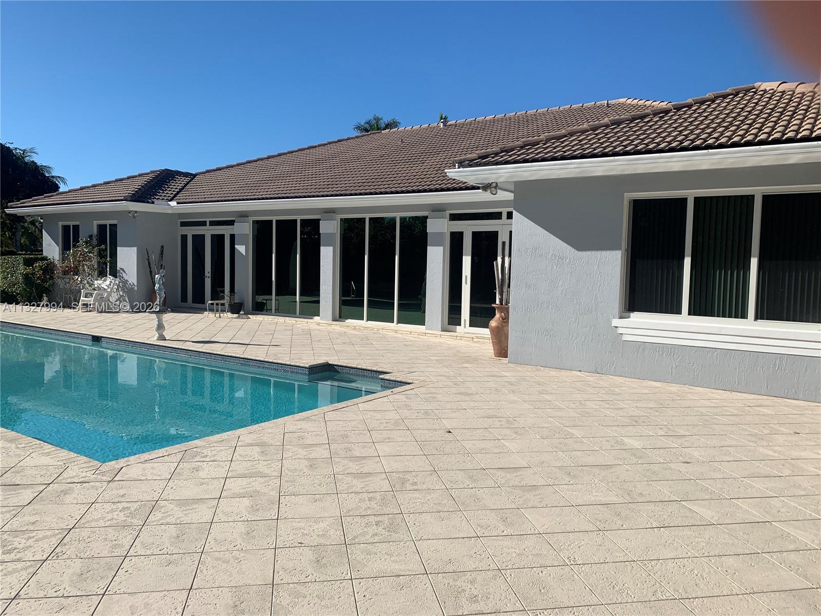 Painted inside/polished marble floors in 2025. NEW ROOF 2024. On a builder's acre. 4,785 liv sq ft/6,280 under roof(appraiser sketch). Only home at end of  cul-de-sac/1 of 4 on the block, walled/2 gates, 4-zone A/C(2015-22) painted outside in '22, complete marble floor('13)NEW kitchen/Miele('13), complete impact windows/doors/solar reflective('21), 36kw Generac quiet generator/1,000 gallon tank('14), volume ceilings, '44 heated lap pool/pool deck('14), summer kitchen w/Viking stove('16) 2-car garage, car port, plus awning car port, no hurricane evac. for cat 1-3/'95 post Andrew build code, not in flood zone, close to 3 highways, high rated schools. Attic storage, LED lights('15), bath(2013). Ca.closets('12). 3 spas. Exer./Game room. Formal liv./din.rooms. Fruit trees. NO​​‌​​​​‌​‌​​​‌‌​​​‌‌‌​​‌​​‌‌​​​​ HOA.