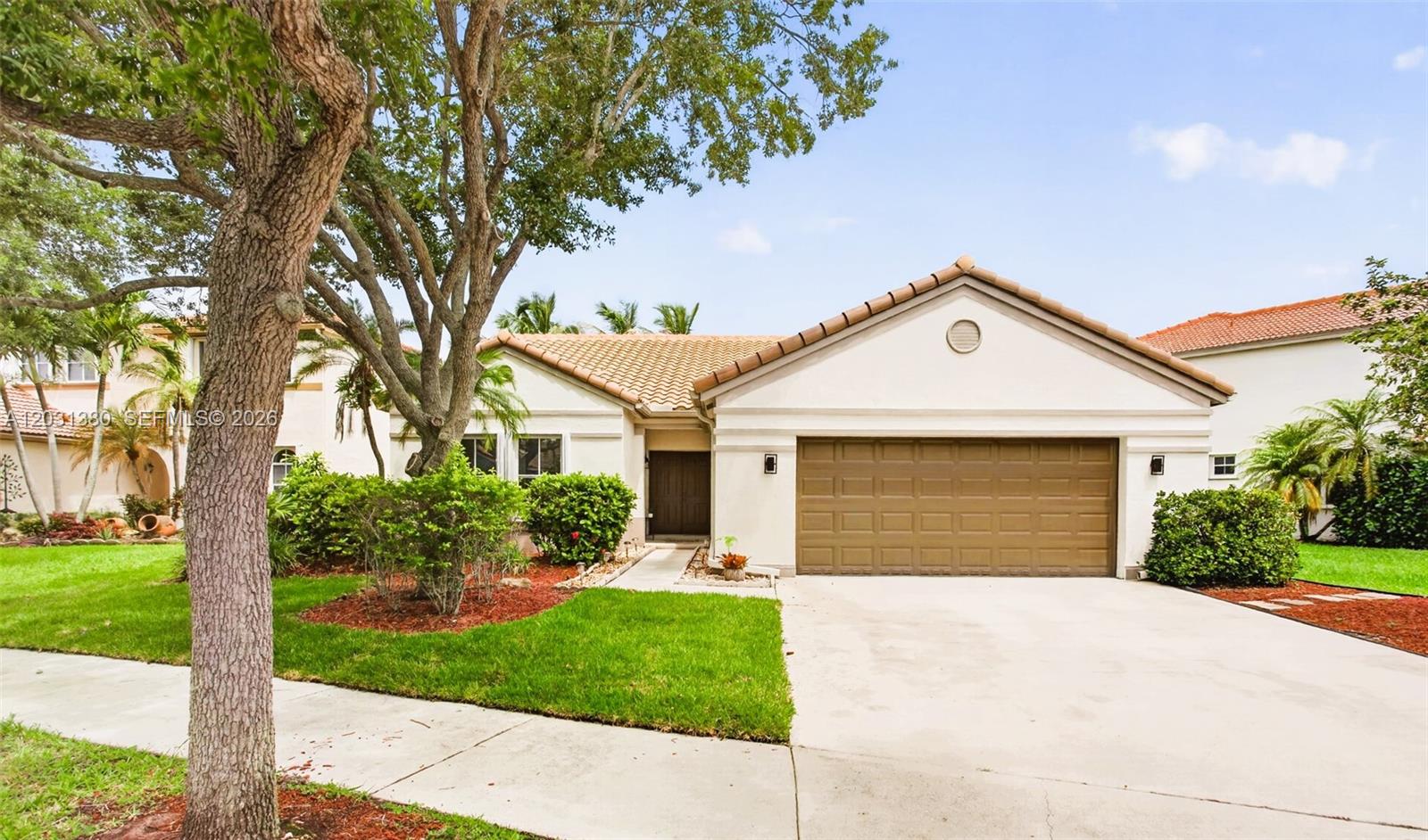 STOP LOOKING! Prepare to FALL IN LOVE with one of the most charming lakefront homes in Weston! Oversized 9,082 sq ft lot with breathtaking water views. Enjoy nature views, spacious yard with your own Mango tree!! Bright open floor plan, soaring high ceilings, and abundant natural light create a warm, inviting atmosphere that feels truly special. Spacious master bedroom with built-in walk-in closets, tastefully remodeled bathroom overlooking the beautiful lake. 
NEW roof, accordion shutters, popcorn ceiling removed, and remodeled bathrooms, including a luxurious master bath overlooking the gorgeous lake, this home blends comfort and elegance effortlessly. 
Screened patio to enjoy peaceful mornings, sunset reflections on the lake, Located in the highly sought-after guard-gated North Lakes community, with access to excellent schools
A rare lakefront gem! Move fast, this one is unforgettable.