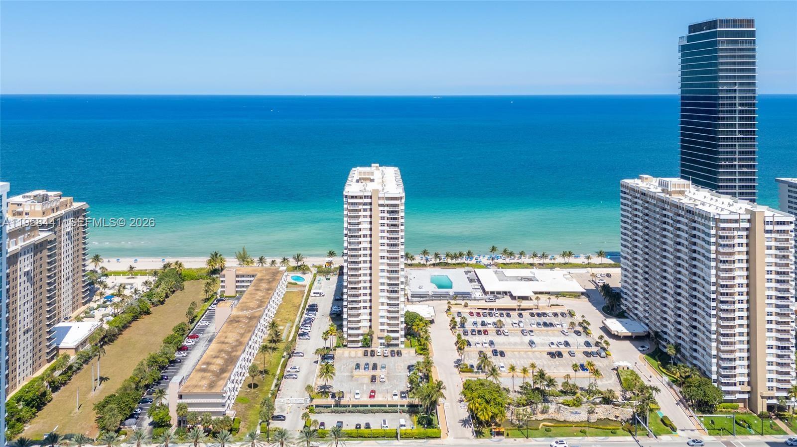 Live the ultimate beachfront lifestyle in this beautifully remodeled 2-bedroom, 2-bathroom corner residence, 1340 SQft, located directly on the sand in Hallandale Beach and offering stunning partial ocean views. The unit has been updated with new flooring throughout, a modern designer kitchen with Quartz countertops and stainless steel appliances, and one renovated bathroom, providing a functional and comfortable layout. The unit includes full impact windows throughout and is move-in ready. 
Full-service oceanfront building with 24-hour guarded security and doorman-attended lobby, two oceanfront pools, fully equipped fitness center, tennis courts, on-site restaurants and bars, and beach service including umbrella and chairs, as well as poolside amenities. 

Maintenance includes air conditioning, water, and internet. Ideal as a primary residence, second home, or investment opportunity.
Seller will pay the current special assessment in full at closing.
Showings by appointment only.