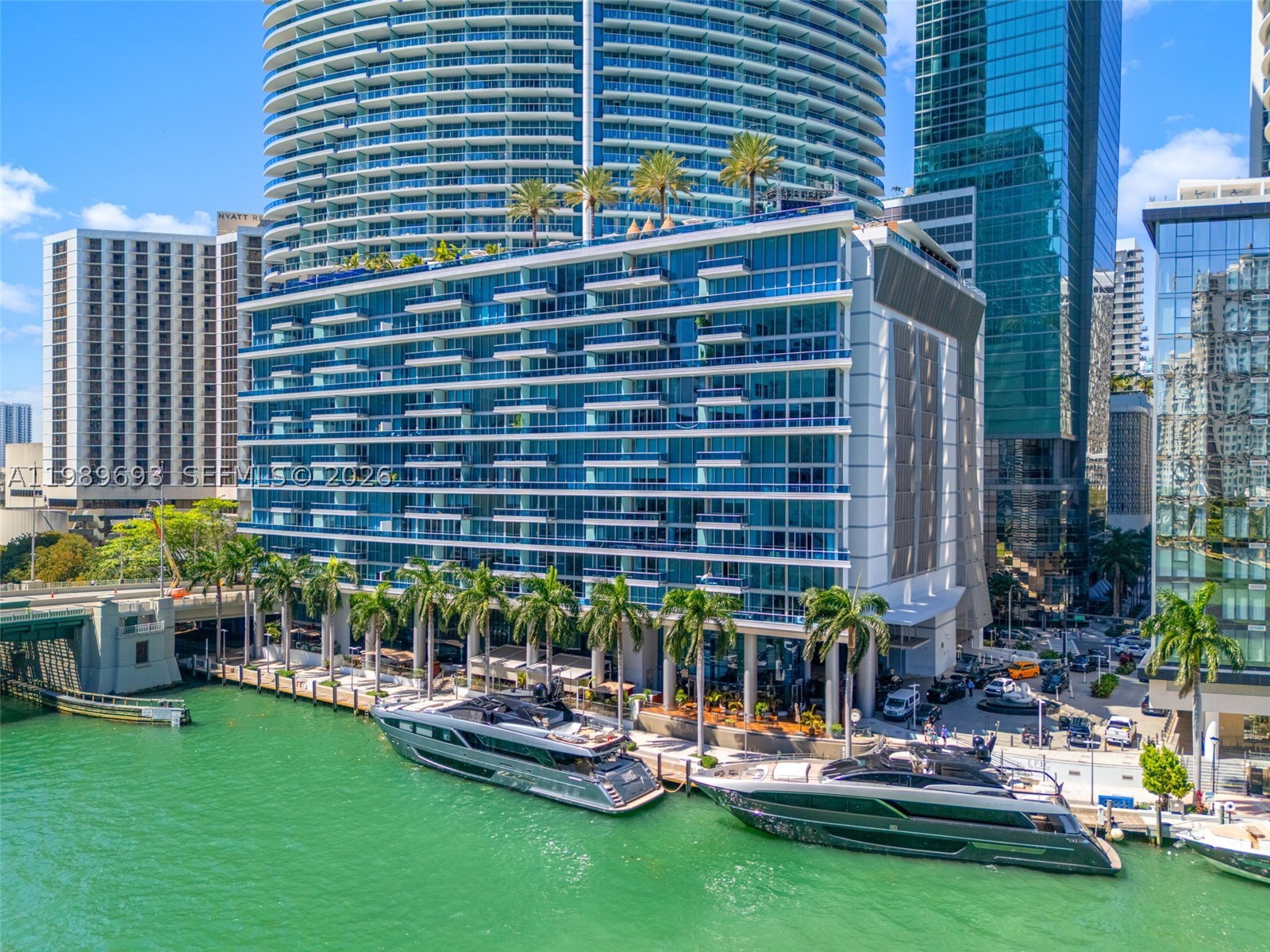 Spectacular 07 Line at Epic Residences — premier waterfront living in Downtown Miami. Impeccably designed 2BR+ Den, 2.5BA with breathtaking Biscayne Bay, Port of Miami, Miami River & Brickell views.  Italian design throughout: Snaidero kitchen, Miele appliances, Sub-Zero refrigerator, Giada marble countertops, dark oak cabinetry,  custom built-in closets, premium Italian tile flooring, marble bathrooms.  Split floor plan floor with spa-inspired primary suite featuring soaking tub, dual vanities and glass-enclosed shower. Enjoy 5-star amenities including resort-style pools, fitness center, wellness center, pool cabanas, concierge, valet and exclusive discounts at Joia Beach Club, Privai Spa, on- site dining at Zuma and Area 31, complimentary weekly movie at Silverspot. Whole Foods and top restaurants like Novikov and Hell's Kitchen right downstairs.  This residence blends luxury, location, & lifestyle—ideal for buyers seeking elegance & convenience.  1 parking spot assigned and storage included.